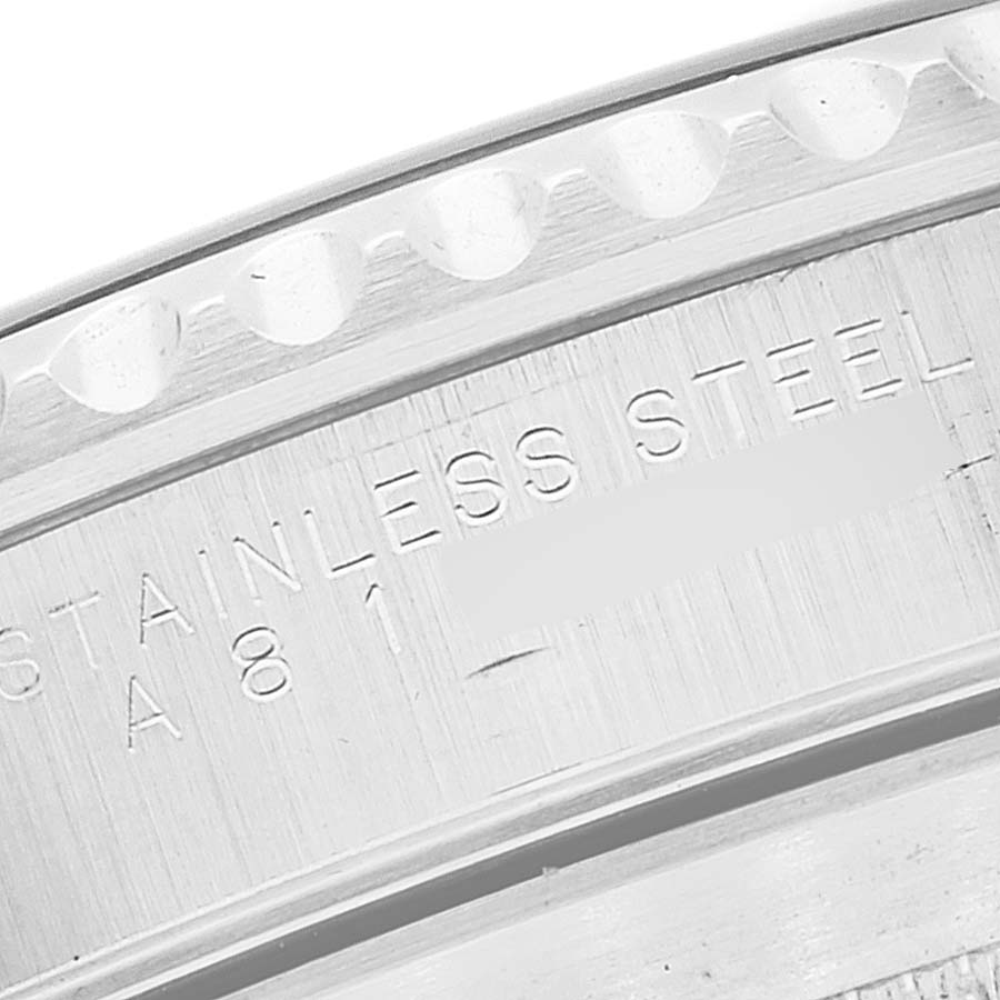 This close-up image shows the engraving on the side of the bezel of a Rolex Submariner 14060 Men
s Stainless Steel Black Dial 14060 Men
s Stainless Steel Black Dial watch, highlighting the text "STAINLESS STEEL."