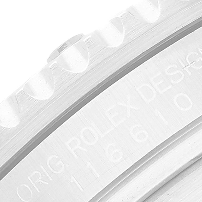 This close-up image shows the bezel and part of the engraved inner rim of a Rolex Submariner 116610 Men
s Stainless Steel Black Dial 116610 Men
s Stainless Steel Black Dial watch.