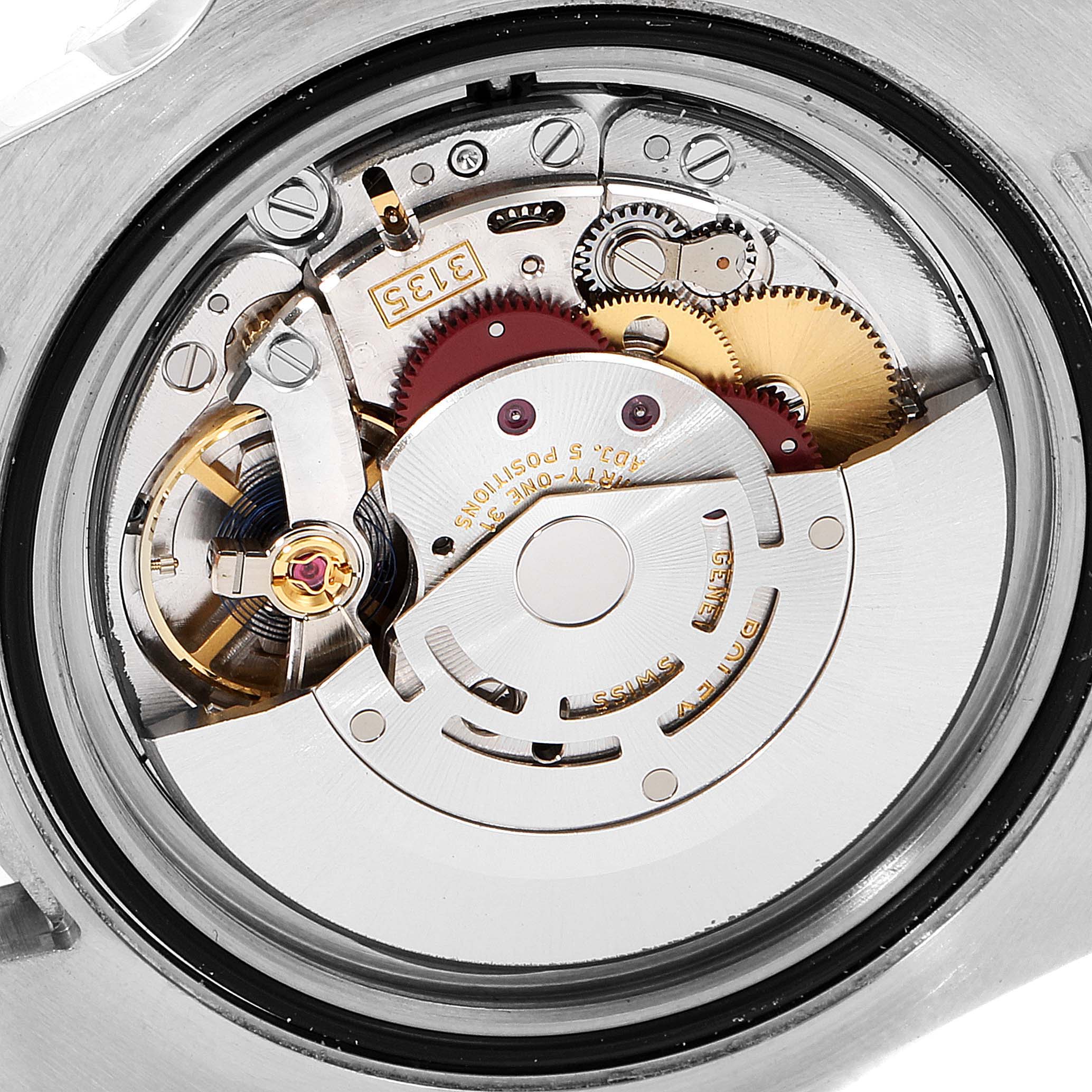 The image shows the intricate internal mechanics of a Rolex Submariner 116610 Men's Stainless Steel Black Dial 116610 Men's Stainless Steel Black Dial, focusing on its movement and gears.