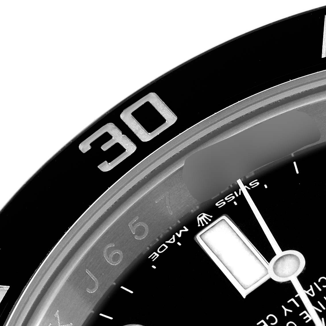 This close-up image shows the bezel and part of the dial of a Rolex Submariner 124060 Men
s Stainless Steel Black Dial 124060 Men
s Stainless Steel Black Dial watch, focusing on the 30-minute marker.