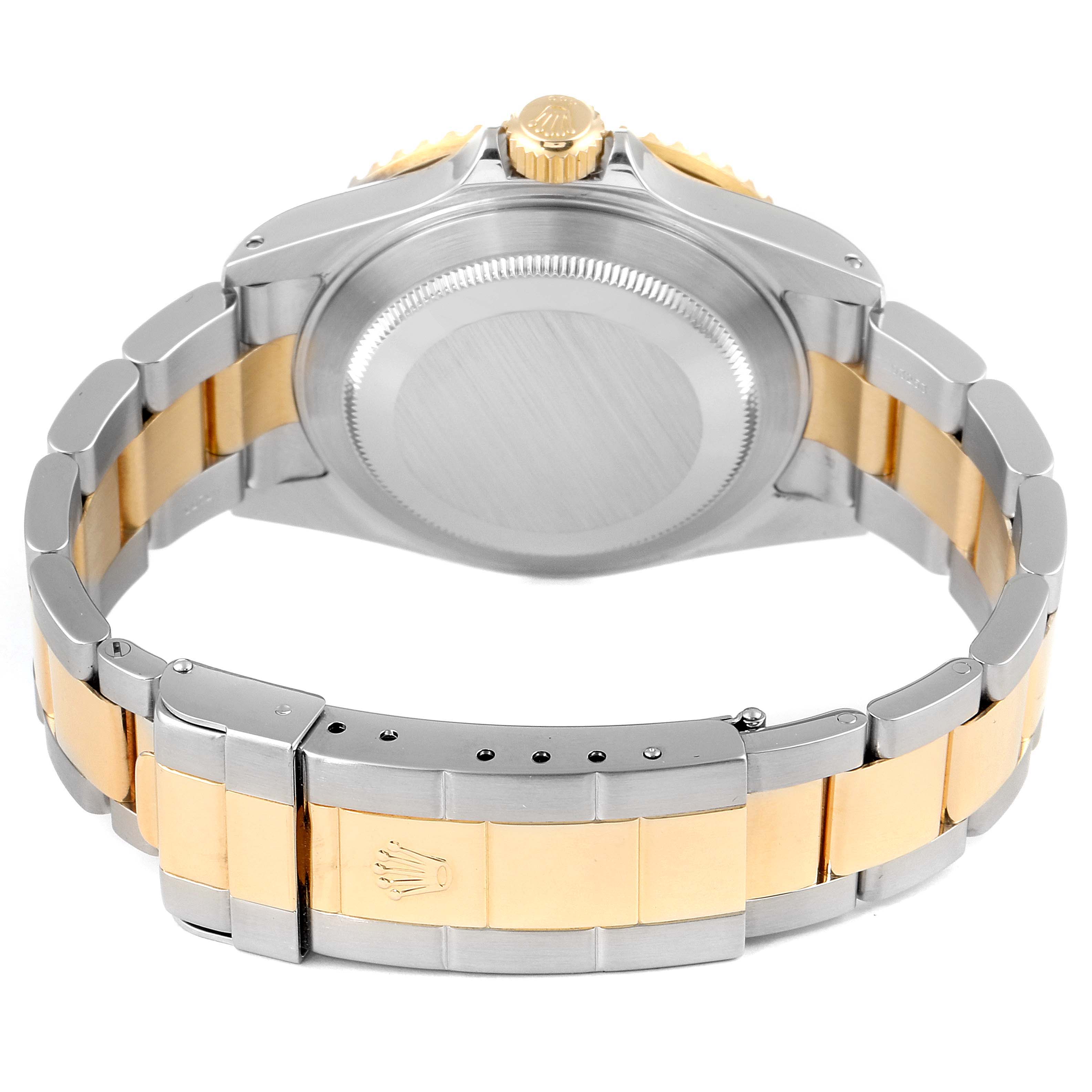 This image shows the back view of a Rolex Submariner 16613 Men's Steel and Gold (two tone) Blue Dial 16613 Men's Steel and Gold (two tone) Blue Dial, highlighting its case back, crown, and bi-metal bracelet.