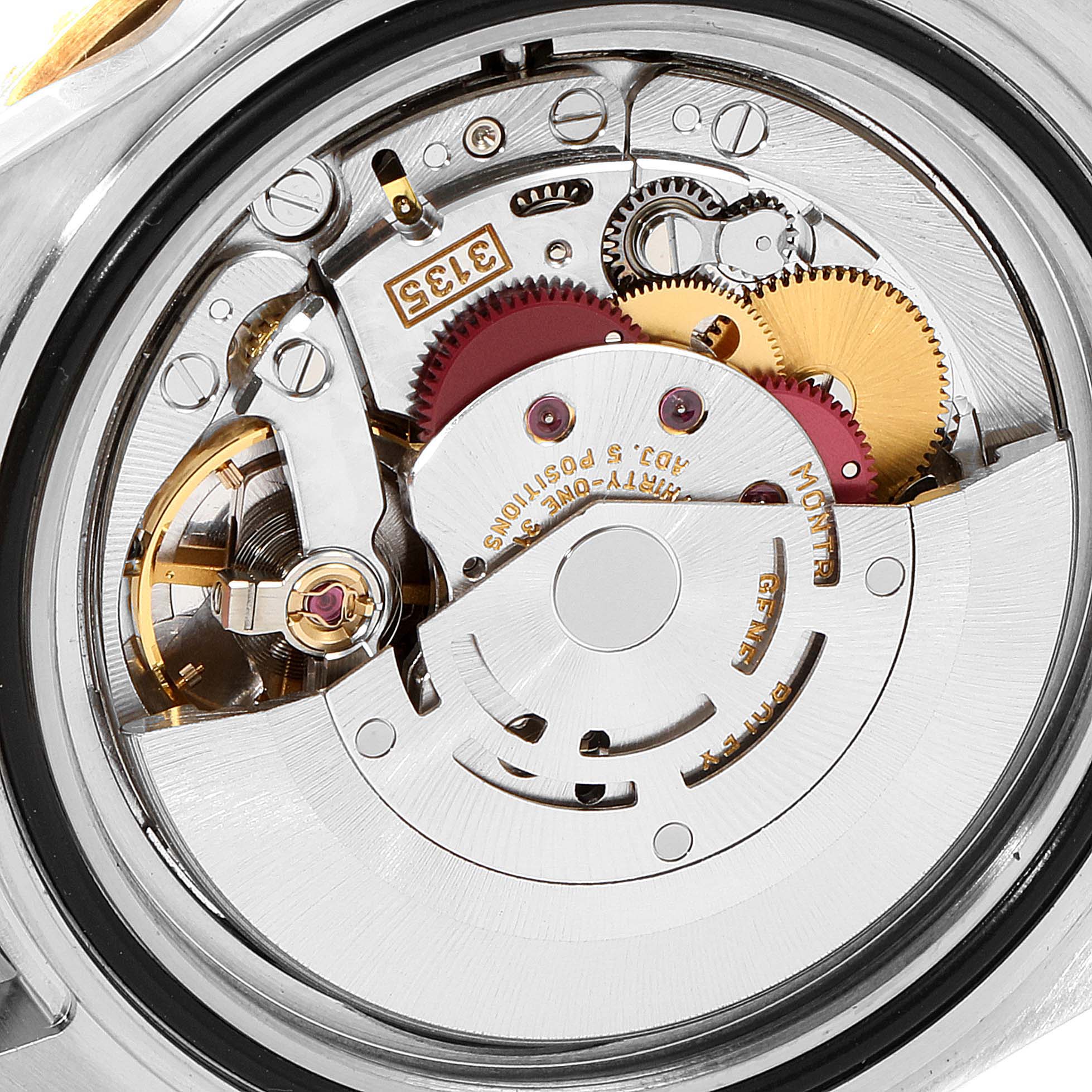 This close-up image shows the internal mechanism and movement of the Rolex Submariner 16613 Men's Steel and Gold (two tone) Blue Dial 16613 Men's Steel and Gold (two tone) Blue Dial watch.