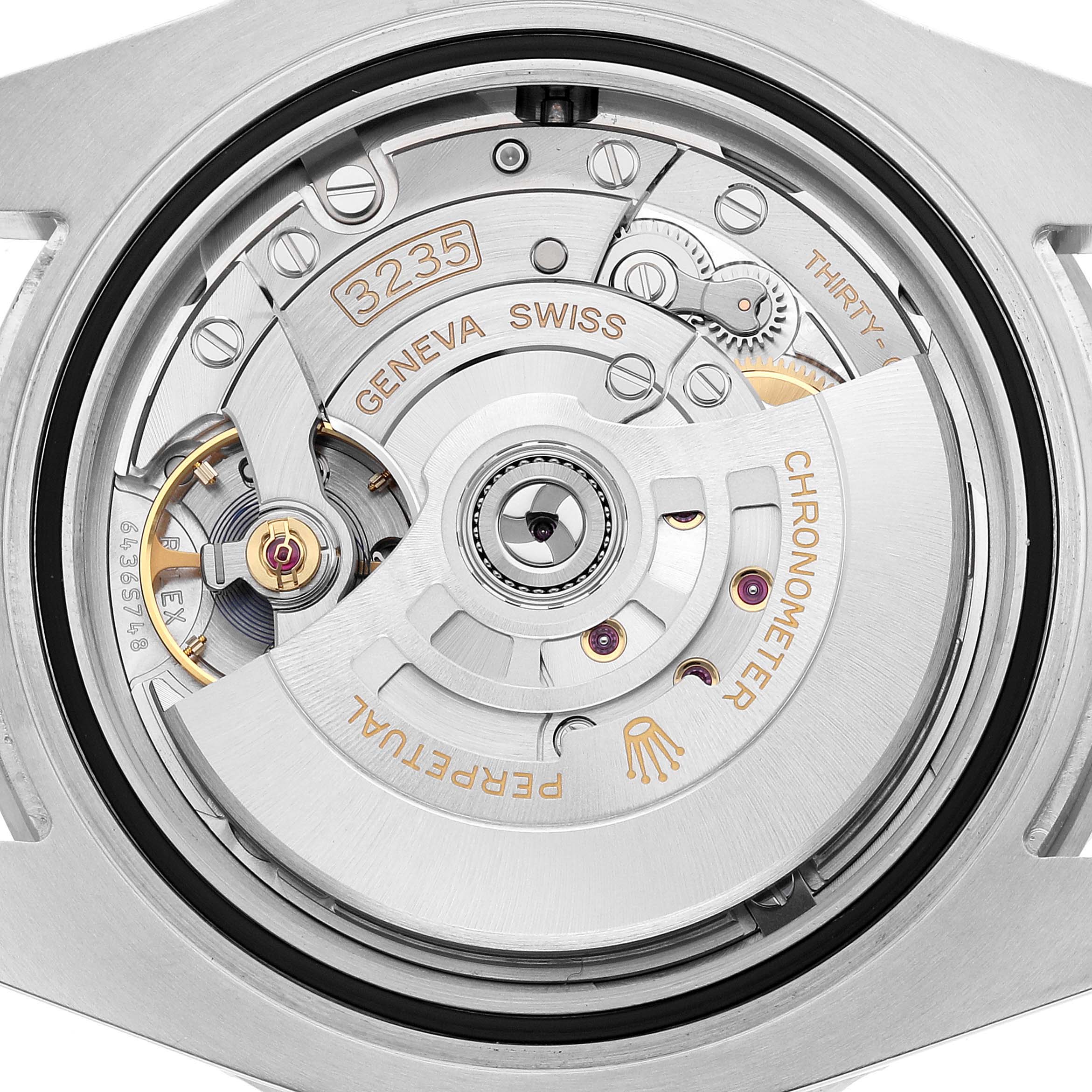 The image shows the case back of a Rolex Submariner 126610LV Men's Stainless Steel Black Dial, revealing the movement with visible rotor and intricate components.