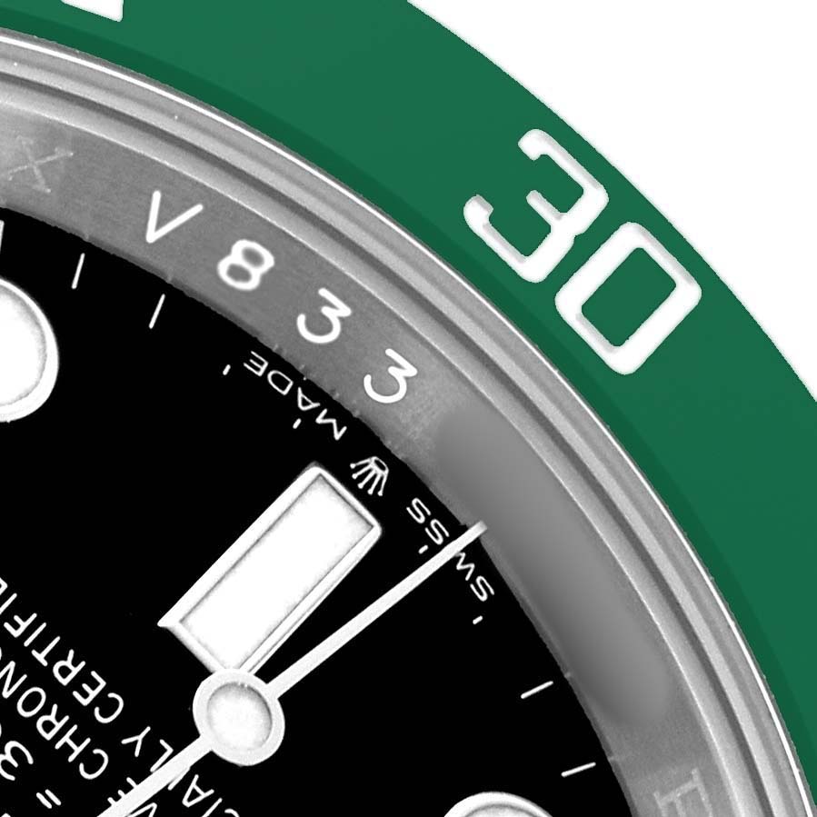The image shows a close-up of the Rolex Submariner 126610LV Men's Stainless Steel Black Dial's green bezel and a portion of the black dial.