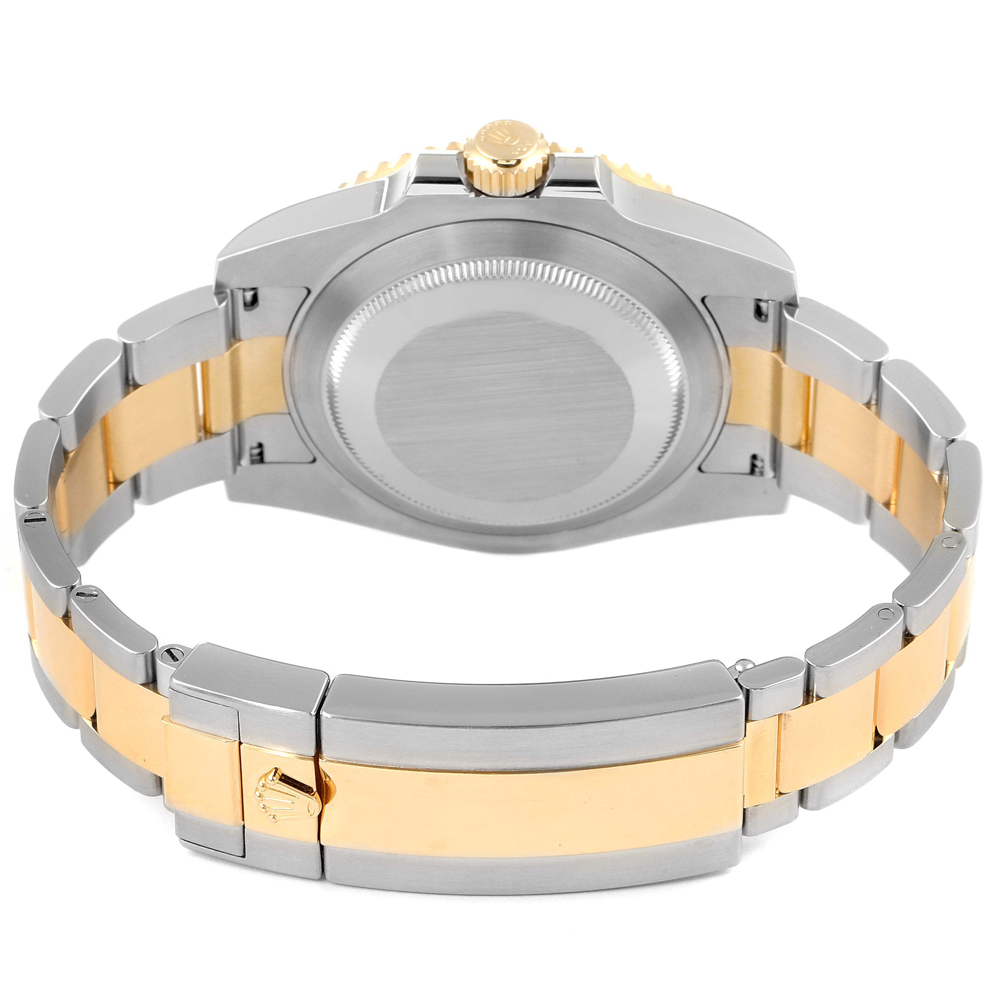 The image shows the back view of the Rolex Submariner 116613 Men's Steel and Gold (two tone) Blue Dial 116613 Men's Steel and Gold (two tone) Blue Dial watch, highlighting the case back and the two-tone bracelet.