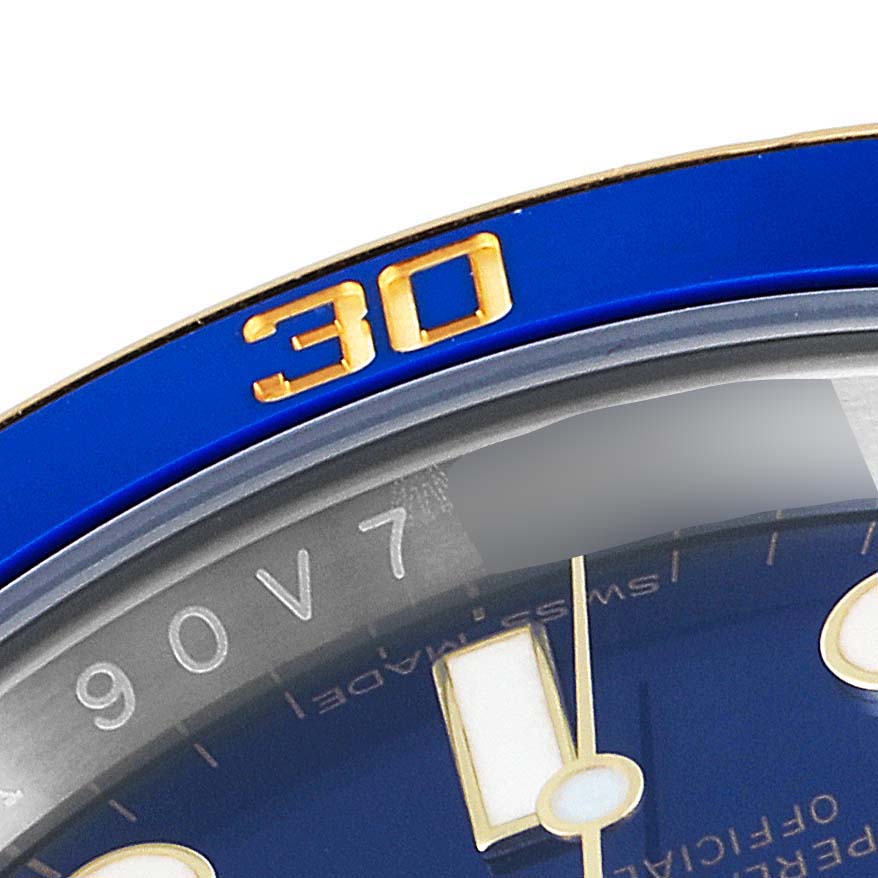 This close-up image of a Rolex Submariner 116613 Men's Steel and Gold (two tone) Blue Dial 116613 Men's Steel and Gold (two tone) Blue Dial watch shows the bezel with a gold "30" and part of the blue dial.
