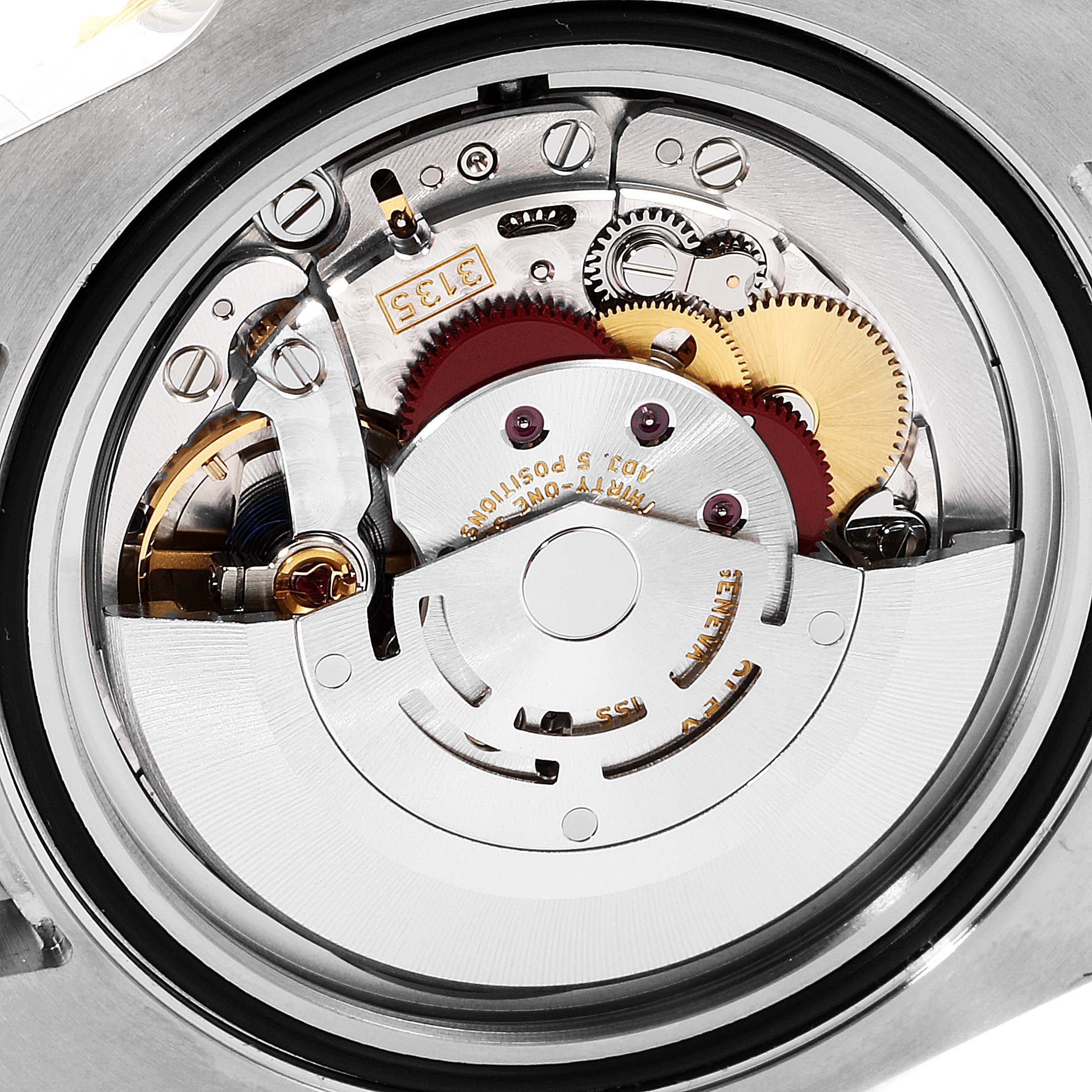 This image shows a close-up of the movement mechanism inside a Rolex Submariner 116613 Men's Steel and Gold (two tone) Blue Dial 116613 Men's Steel and Gold (two tone) Blue Dial watch, highlighting gears and intricate components.