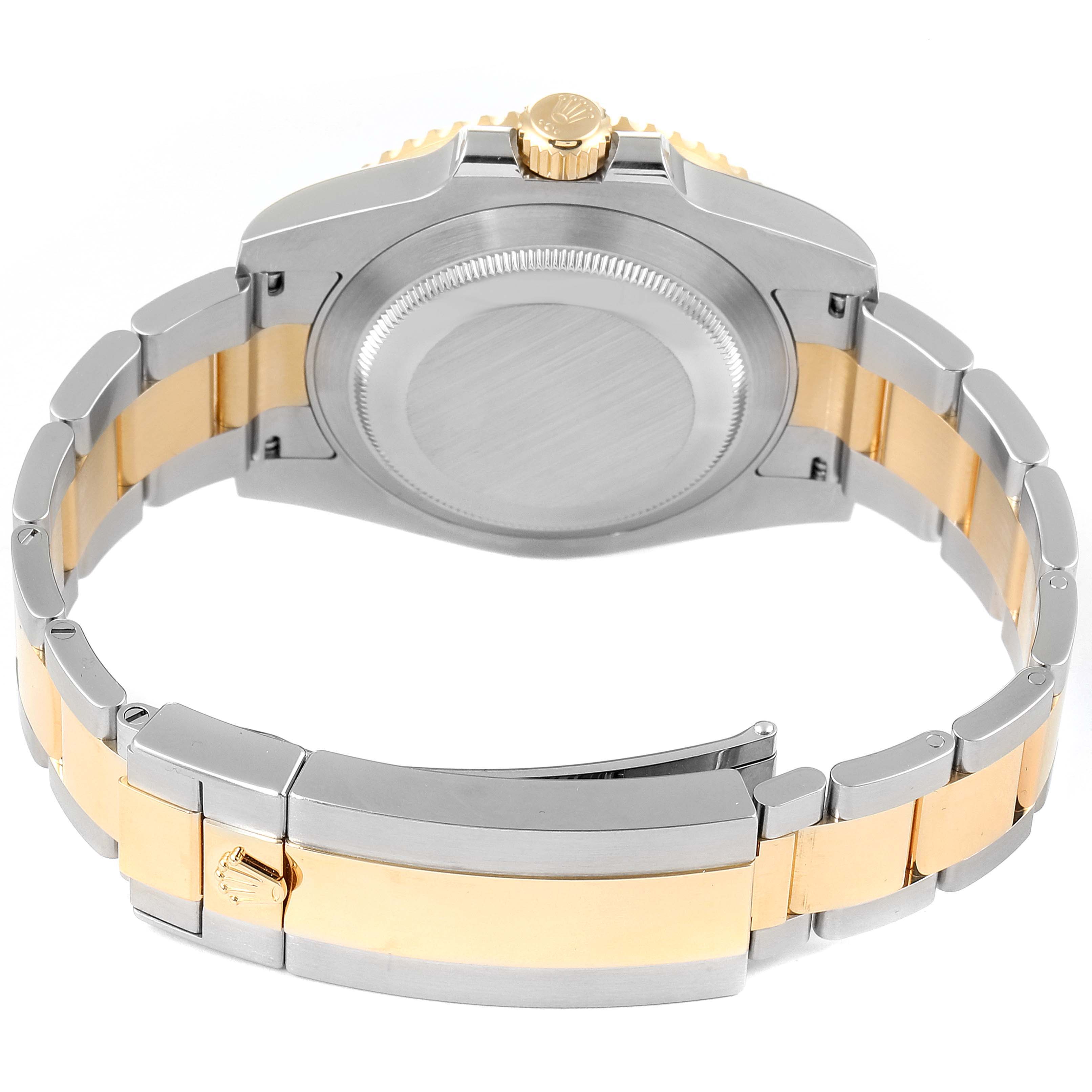 The image shows the back view of a Rolex Submariner 116613 Men's Steel and Gold (two tone) Blue Dial 116613 Men's Steel and Gold (two tone) Blue Dial, highlighting its stainless steel and gold bracelet and clasp.