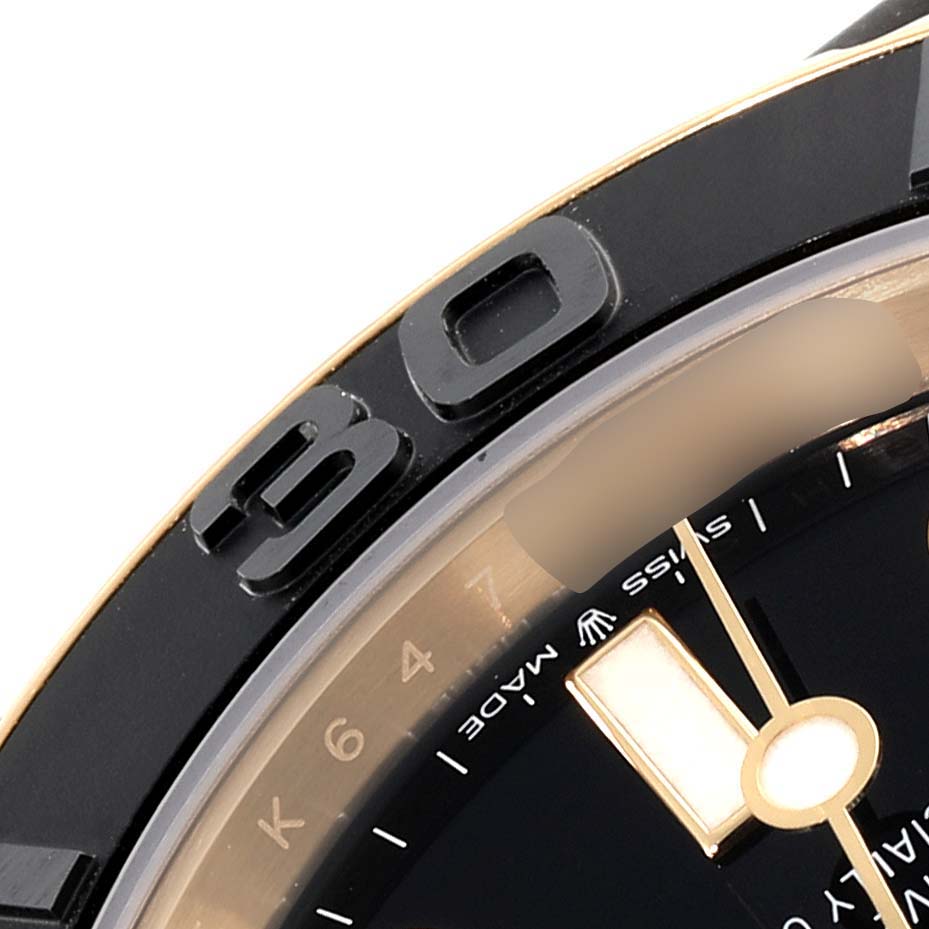 This image shows a close-up of the bezel, part of the dial, and the minute hand of the Rolex Yacht-Master 226658 Men's Yellow Gold Black Dial 226658 Men's Yellow Gold Black Dial watch.