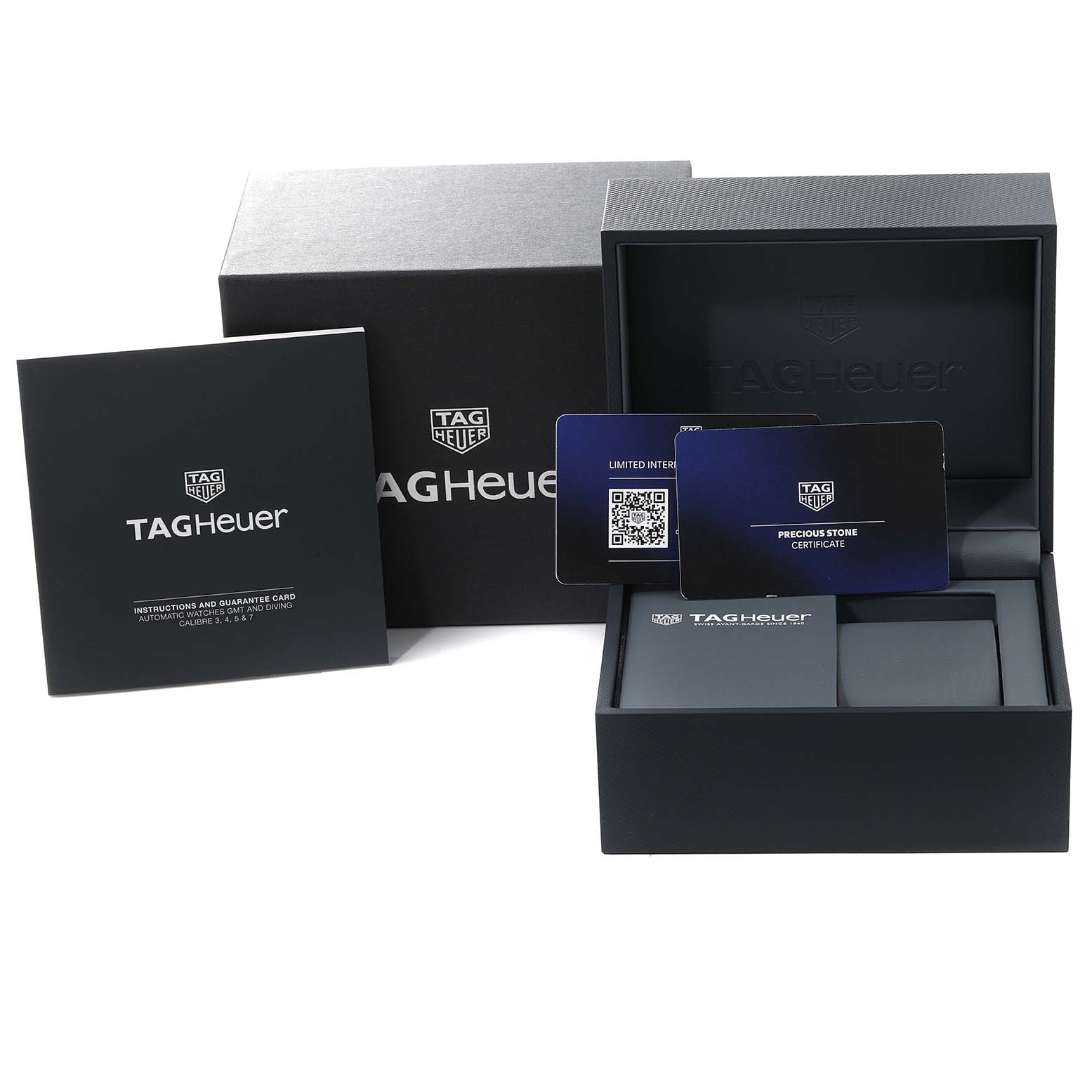 The image shows the packaging and accessories for the Tag Heuer Aquaracer WBP231K.BA0618 Women
s Stainless Steel Green Dial WBP231K.BA0618 Women
s Stainless Steel Green Dial, including the box, booklet, and certificates.