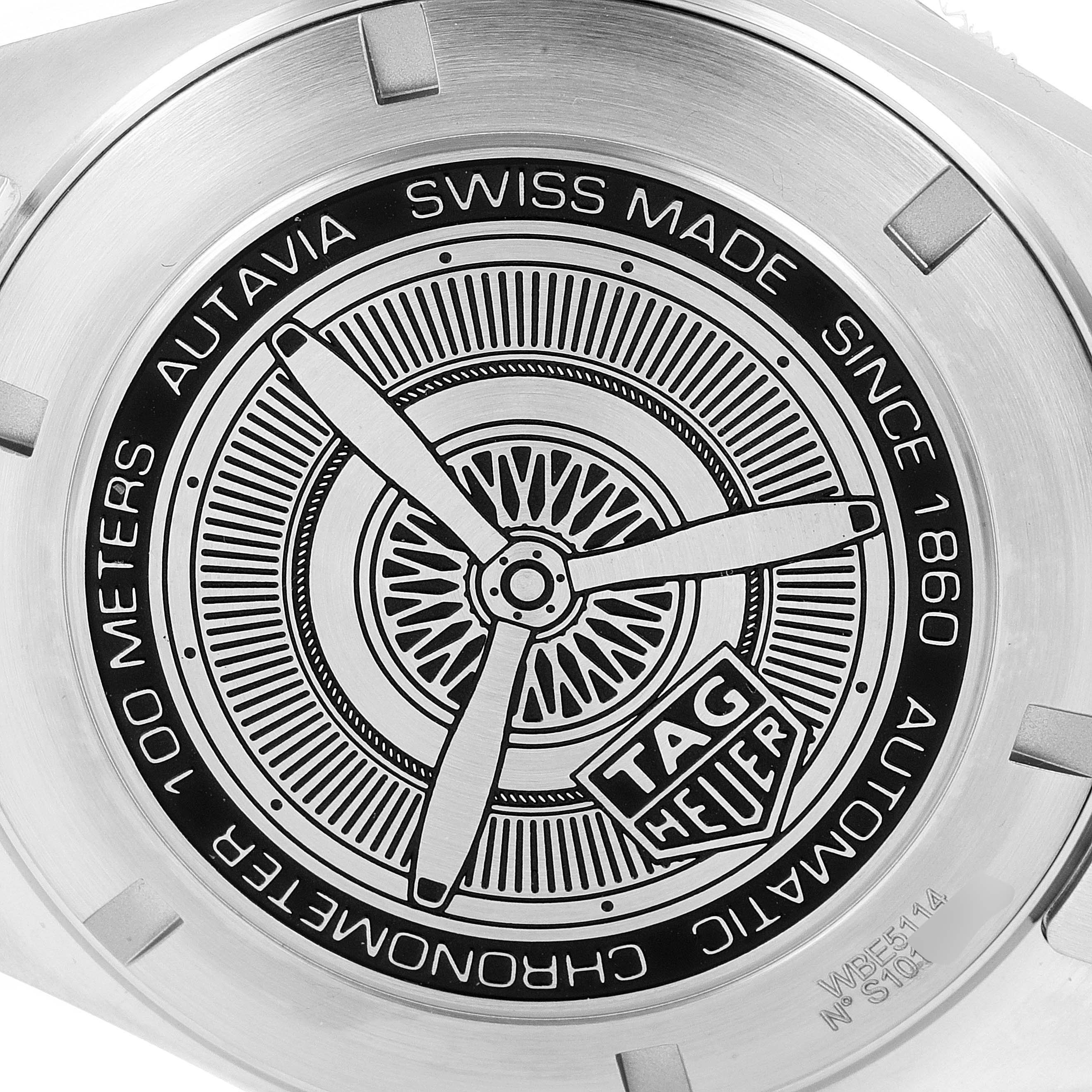 This image shows the back of a Tag Heuer Autavia WBE5114.EB0173 Men's Stainless Steel Brown Dial WBE5114.EB0173 Men's Stainless Steel Brown Dial watch, highlighting the engraved design and brand inscriptions.