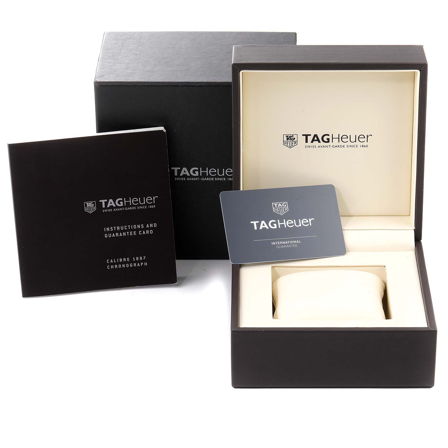 This image shows the packaging, instruction manual, and guarantee card for the Tag Heuer Carrera CAR2A10.BA0799 Men
s Stainless Steel Black Dial CAR2A10.BA0799 Men
s Stainless Steel Black Dial watch.