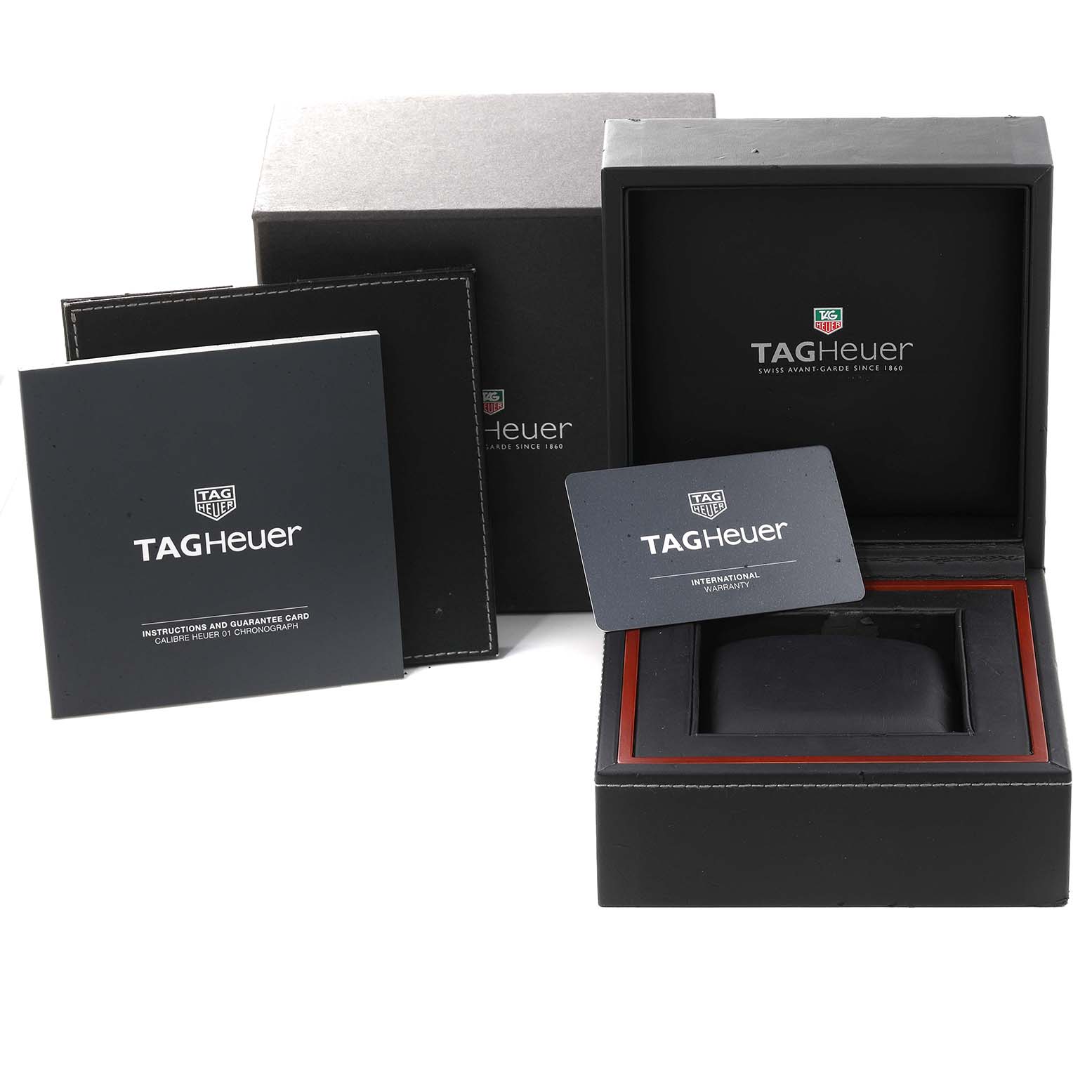 The image shows the Tag Heuer Carrera CAR2A1W.BA0703 Men's Stainless Steel Transparent Dial CAR2A1W.BA0703 Men's Stainless Steel Transparent Dial watch box, international warranty card, instruction booklet, and outer packaging.