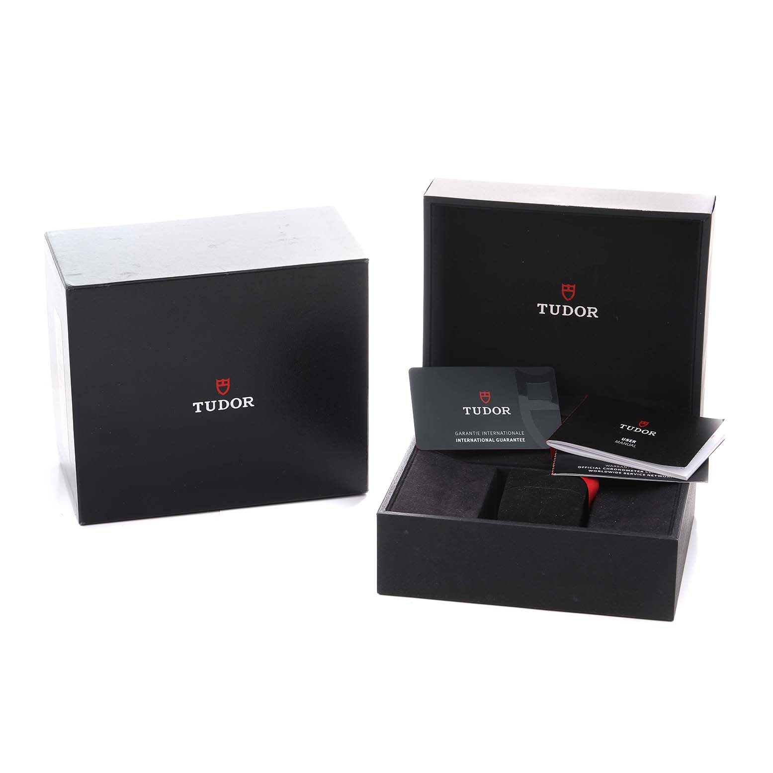 The image shows the Tudor Heritage Black Bay M79030N-0001 Men's Stainless Steel Black Dial watch box, guarantee card, and manuals from a front angle.