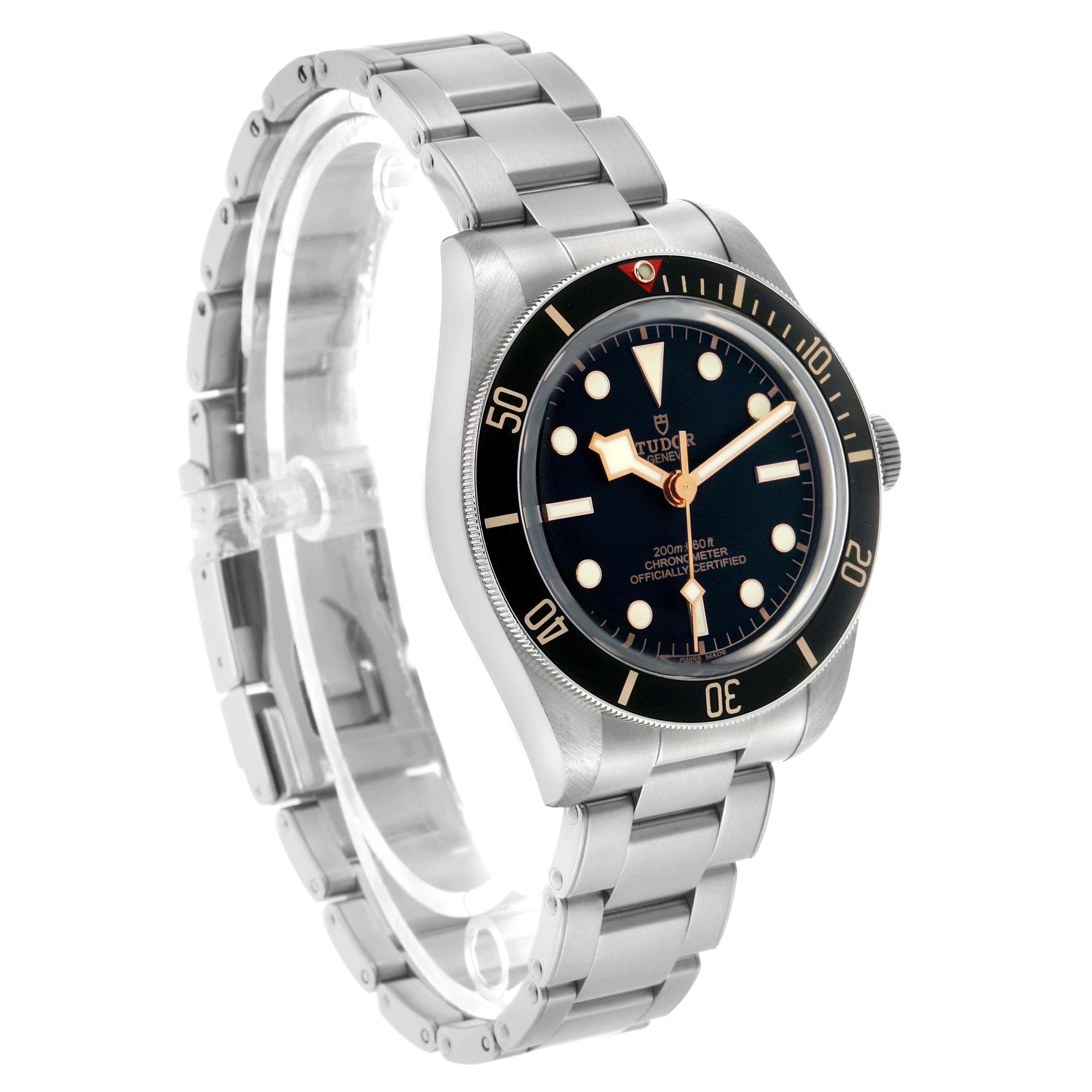 The Tudor Heritage Black Bay M79030N-0001 Men's Stainless Steel Black Dial watch is shown at a three-quarter angle, highlighting the dial, bezel, bracelet, and crown.