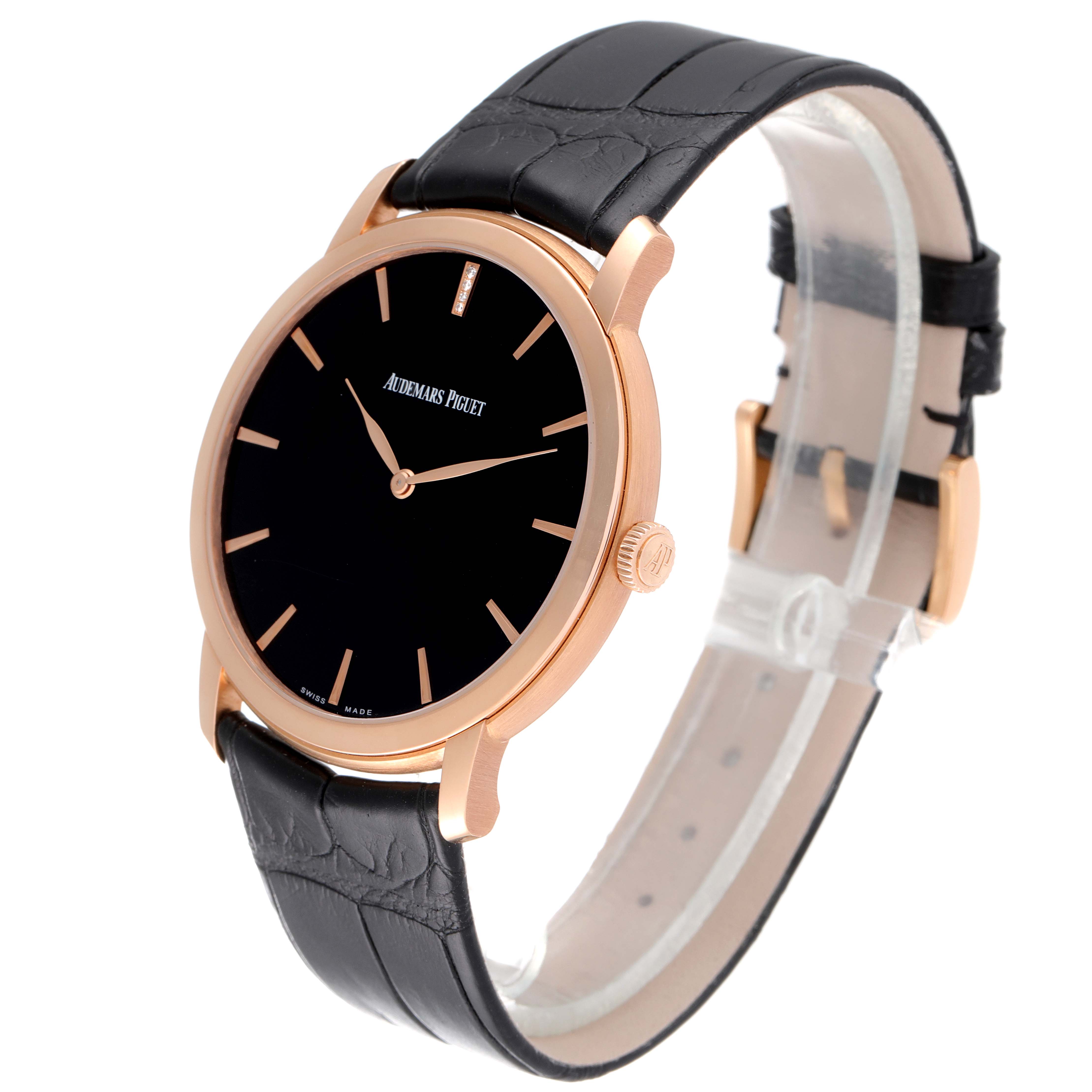 The image shows a Jules model by Audemars Piguet at a slight angle, highlighting the black dial, gold case, and black leather strap.