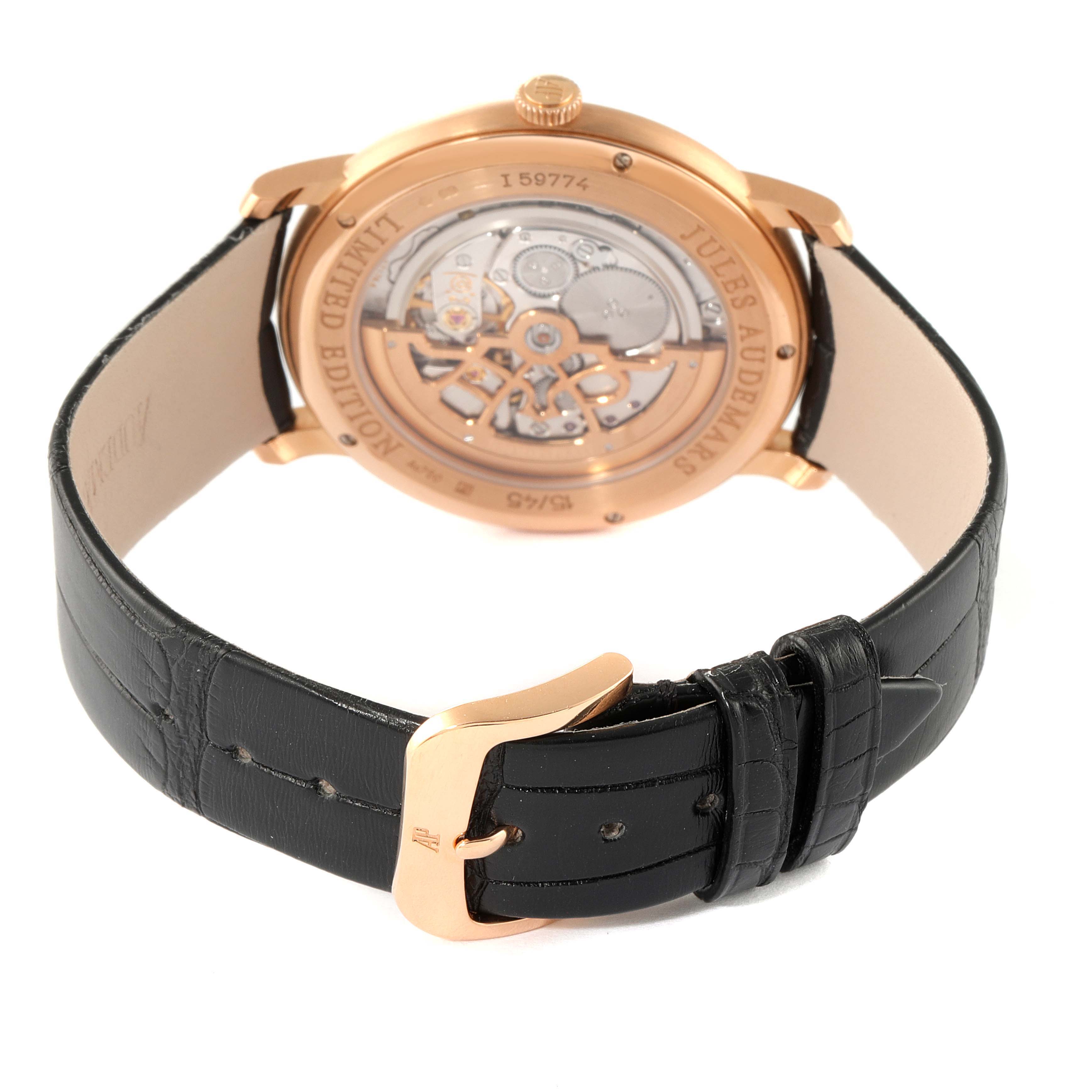 The image shows the back view of the Audemars Piguet Jules 15184OR.OO.A102CR.01 Men's Rose Gold Black Dial 15184OR.OO.A102CR.01 Men's Rose Gold Black Dial watch, highlighting its mechanical movement and black leather strap.