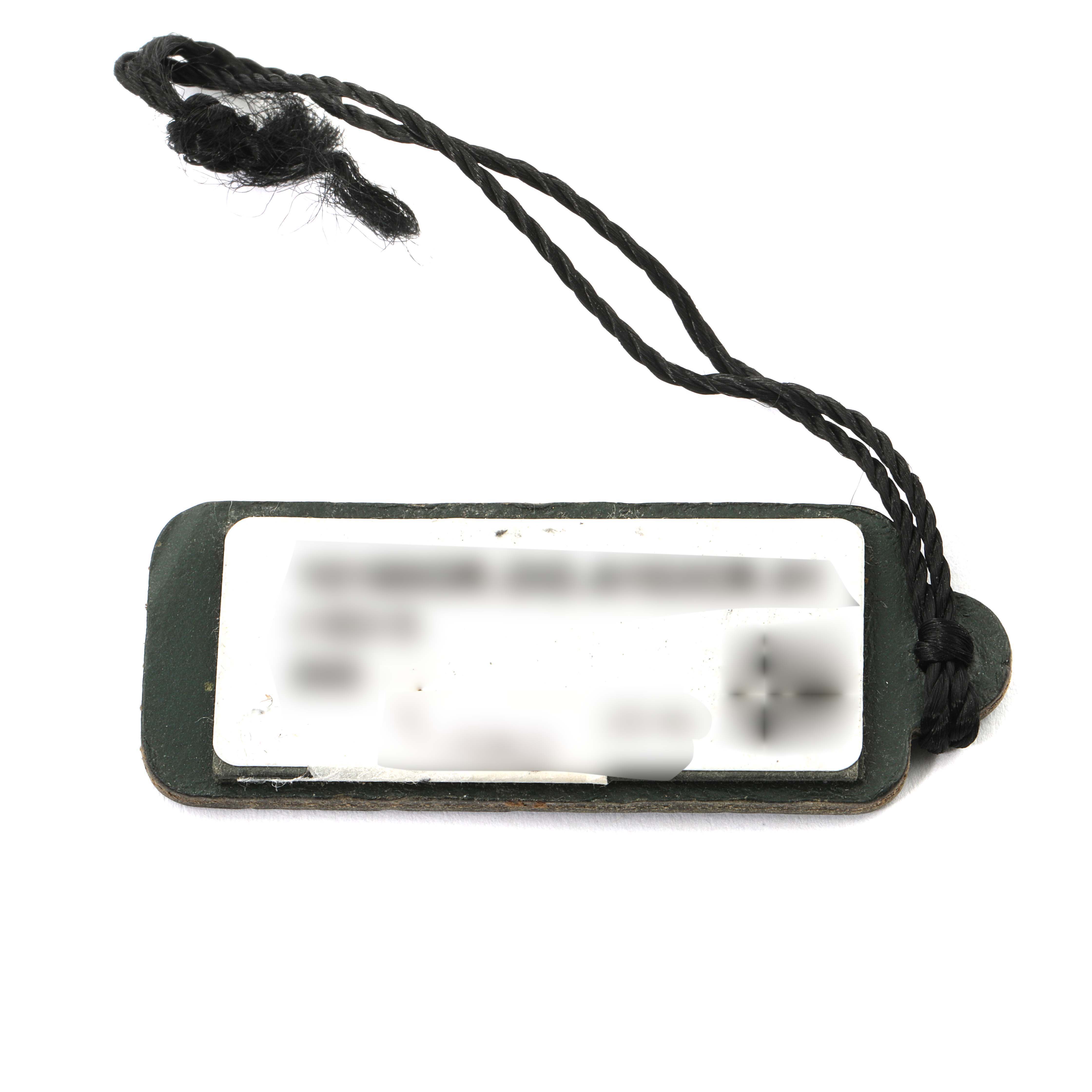 The image shows a close-up of the tag from the Audemars Piguet Jules 15180OR.OO.A102CR.01 Men
s Rose Gold Silver Dial 15180OR.OO.A102CR.01 Men
s Rose Gold Silver Dial model watch with a string attached.