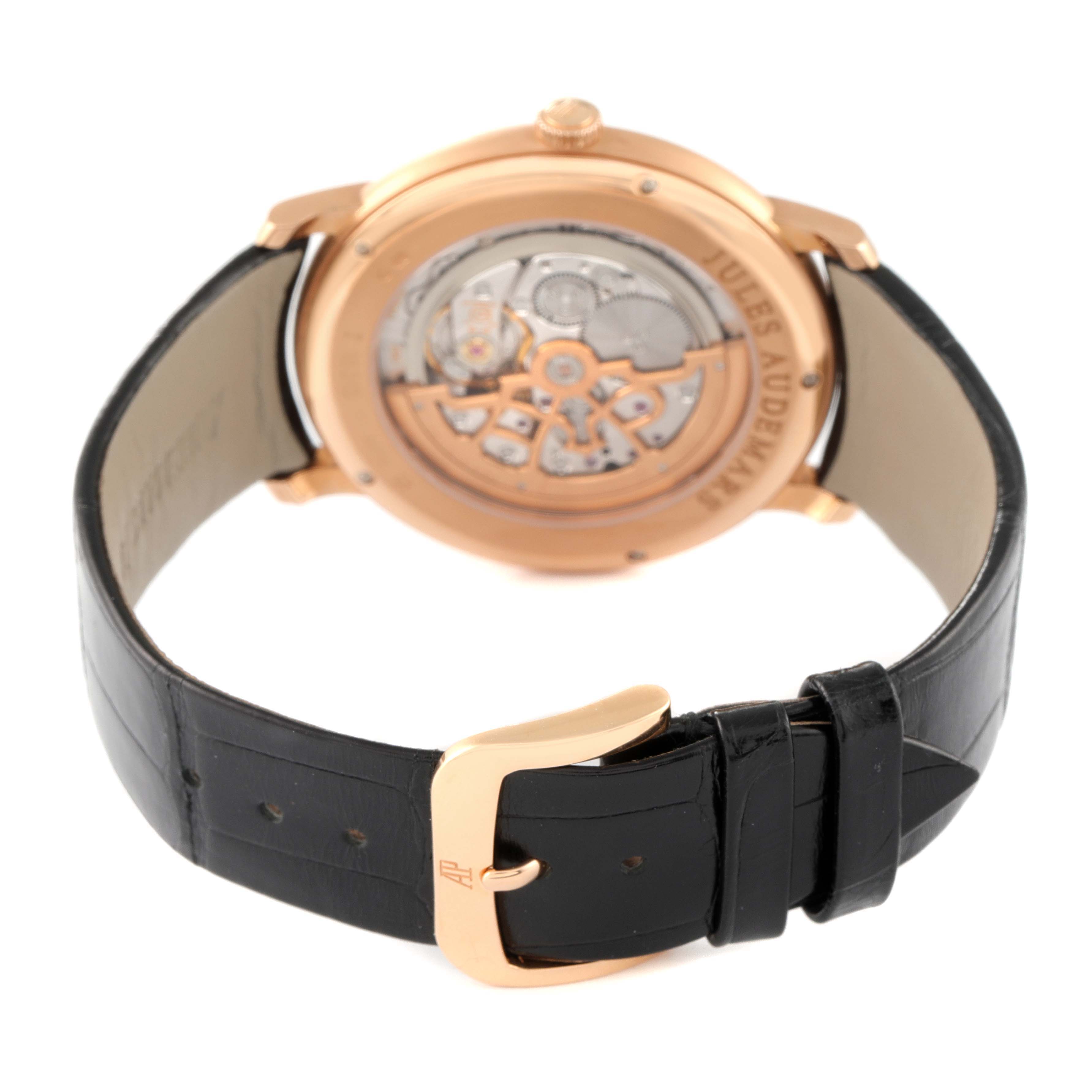 The image shows the back and movement, plus the strap and buckle of an Audemars Piguet Jules 15180OR.OO.A102CR.01 Men
s Rose Gold Silver Dial 15180OR.OO.A102CR.01 Men
s Rose Gold Silver Dial model watch.