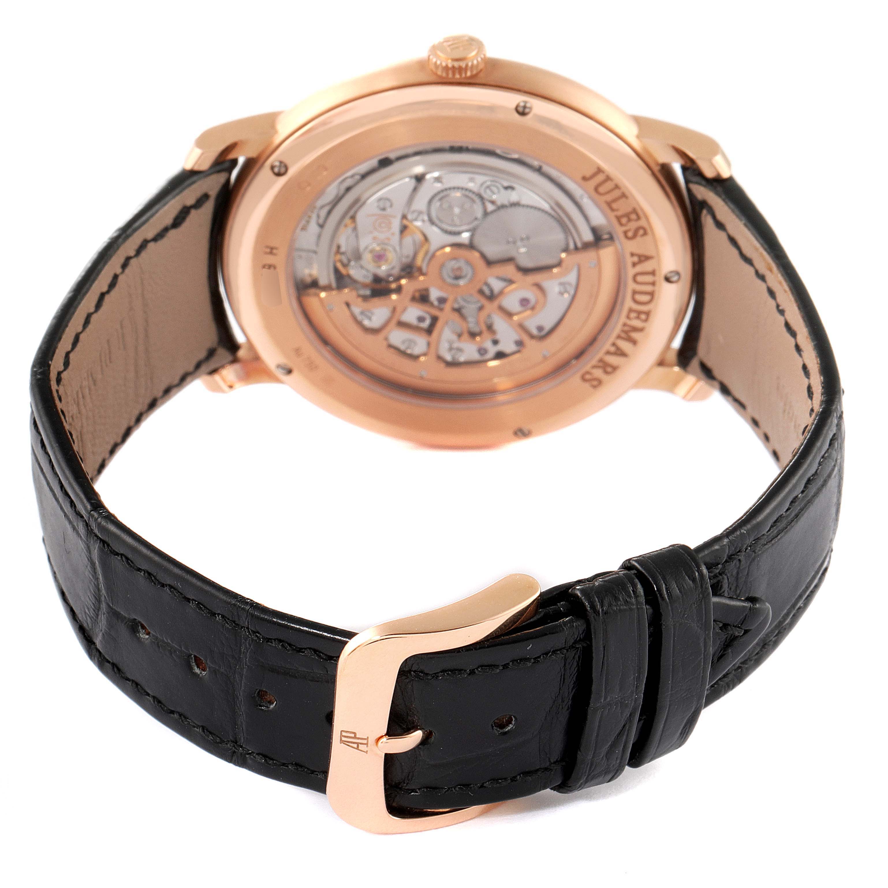 The image shows the back view of a Jules watch by Audemars Piguet, highlighting the movement and the clasp on the black leather strap.