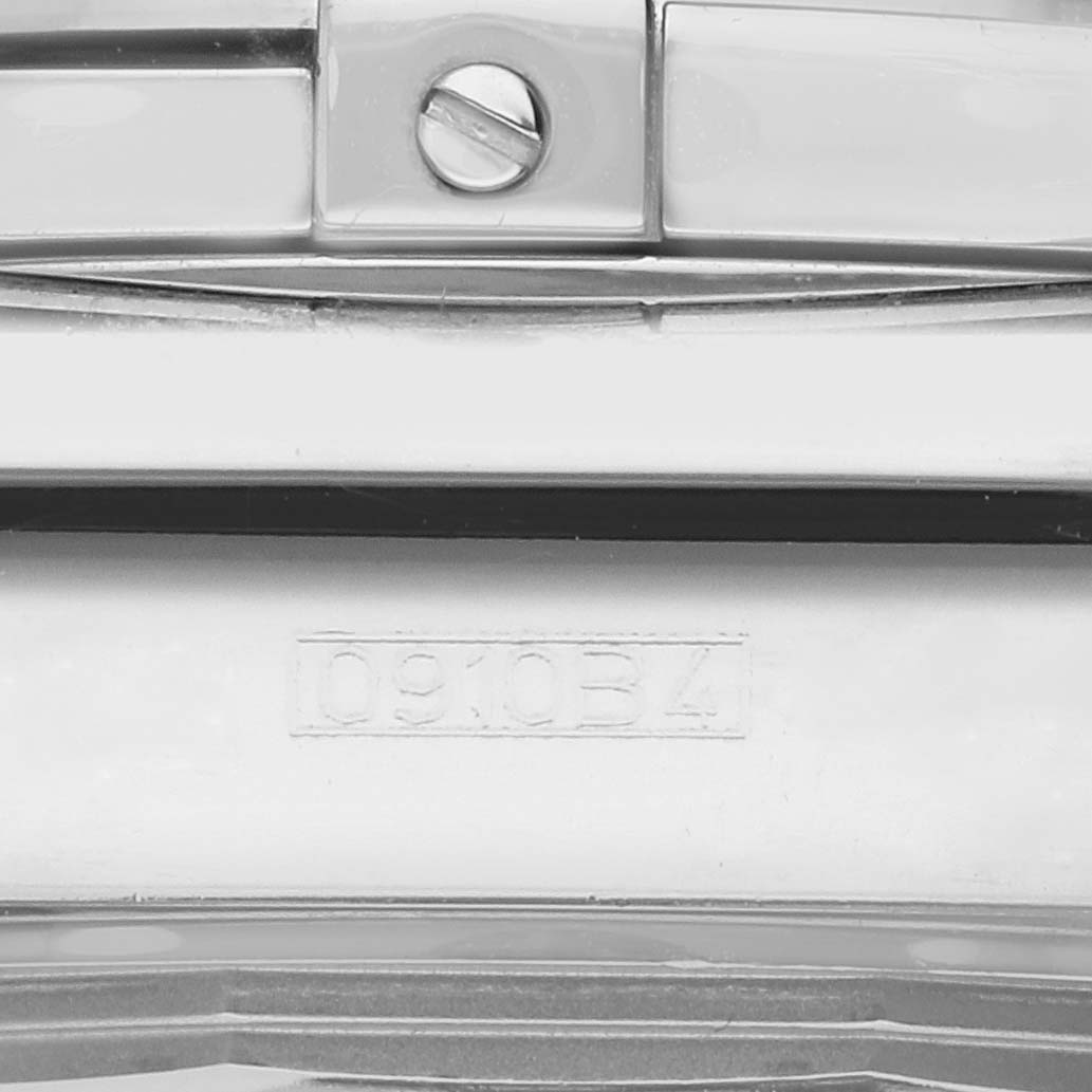 The image shows a close-up of the clasp and part of the bracelet of a Breitling Chronomat AB0110 Men's Stainless Steel Black Dial watch.