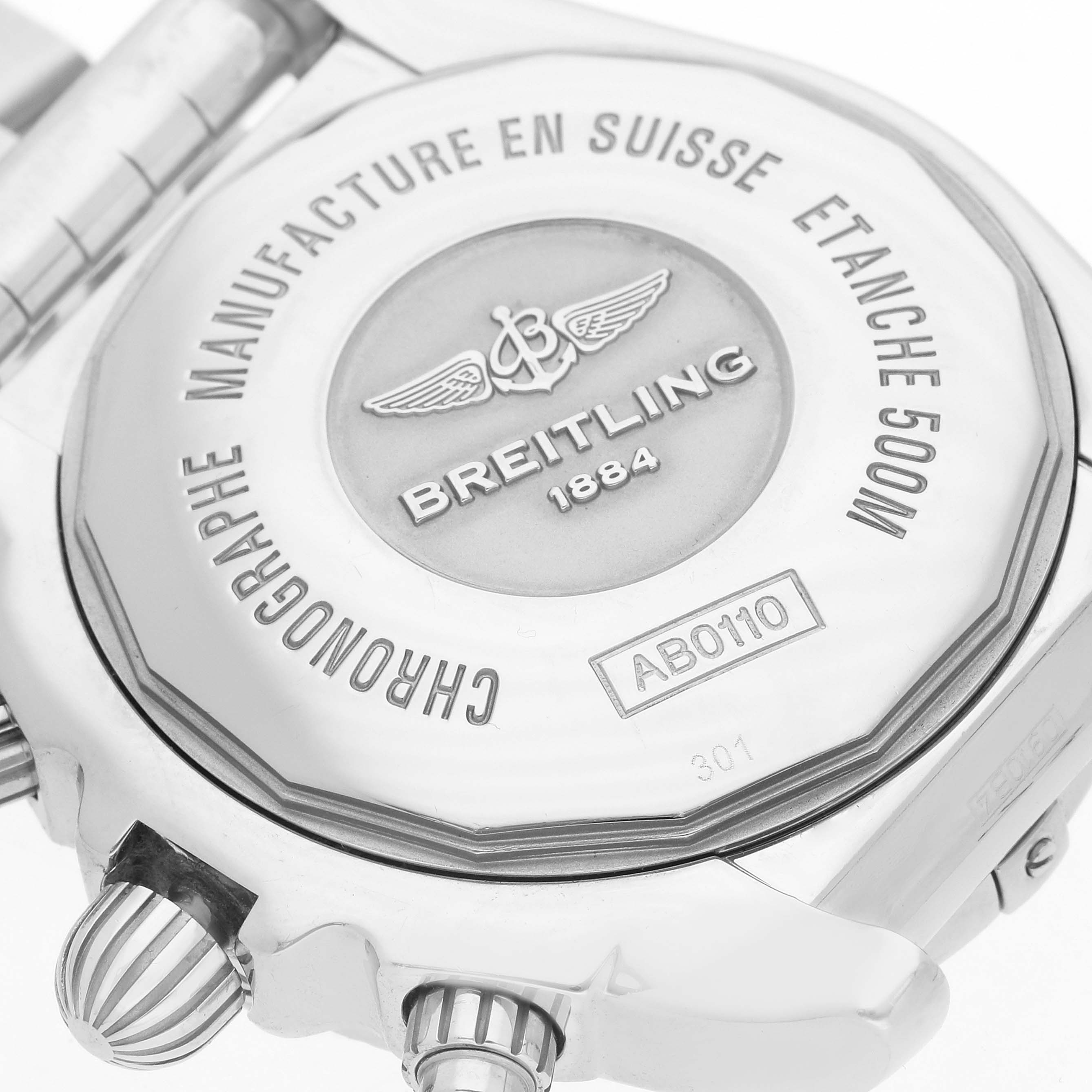 The image shows the back case of a Breitling Chronomat AB0110 Men's Stainless Steel Black Dial watch, highlighting engravings and the winding crown.