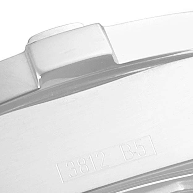 This image shows a close-up of the side of a Breitling Colt A73380 Men's Stainless Steel White Dial A73380 Men's Stainless Steel White Dial watch, showcasing part of the bezel and a serial number.