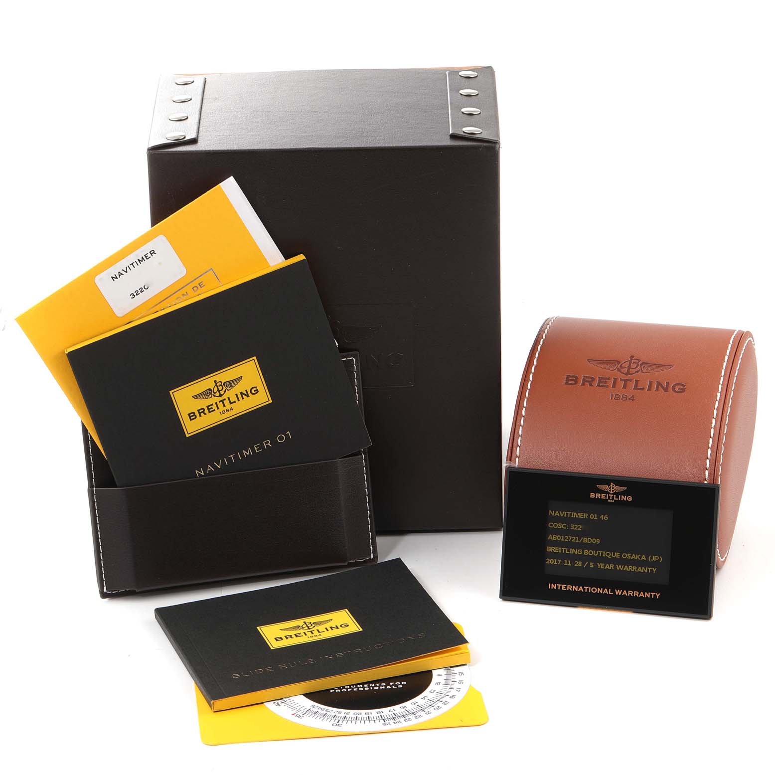 The image shows the Breitling Navitimer AB0127211C1A1 Men
s Stainless Steel Black Dial AB0127211C1A1 Men
s Stainless Steel Black Dial watch
s packaging, warranty card, manuals, and a leather travel case.