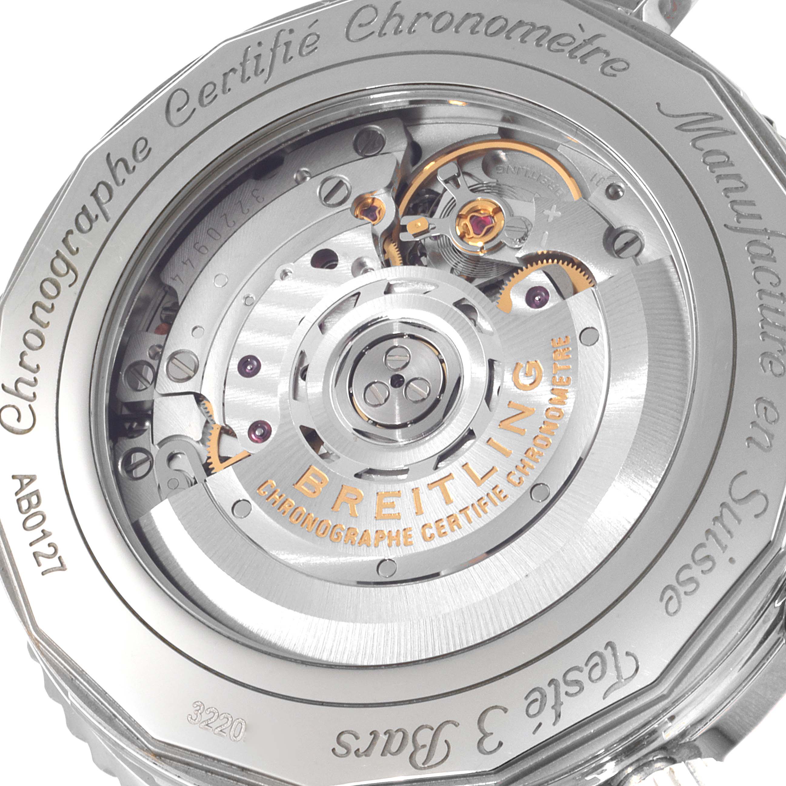 The image shows the case back view of a Breitling Navitimer AB0127211C1A1 Men
s Stainless Steel Black Dial AB0127211C1A1 Men
s Stainless Steel Black Dial watch mechanism and its engravings.