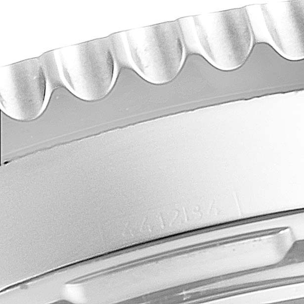 This image shows a close-up of the bezel and the edge of the case of a Breitling Navitimer AB0120 Men's Stainless Steel Black Dial AB0120 Men's Stainless Steel Black Dial watch.
