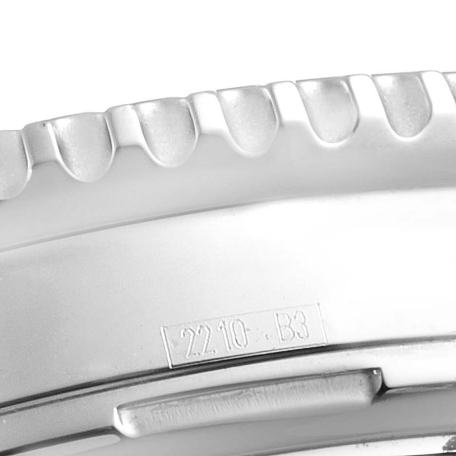 This image shows a close-up of the bezel and part of the case of a Breitling Navitimer A23322 Men
s Stainless Steel Blue Dial A23322 Men
s Stainless Steel Blue Dial watch.