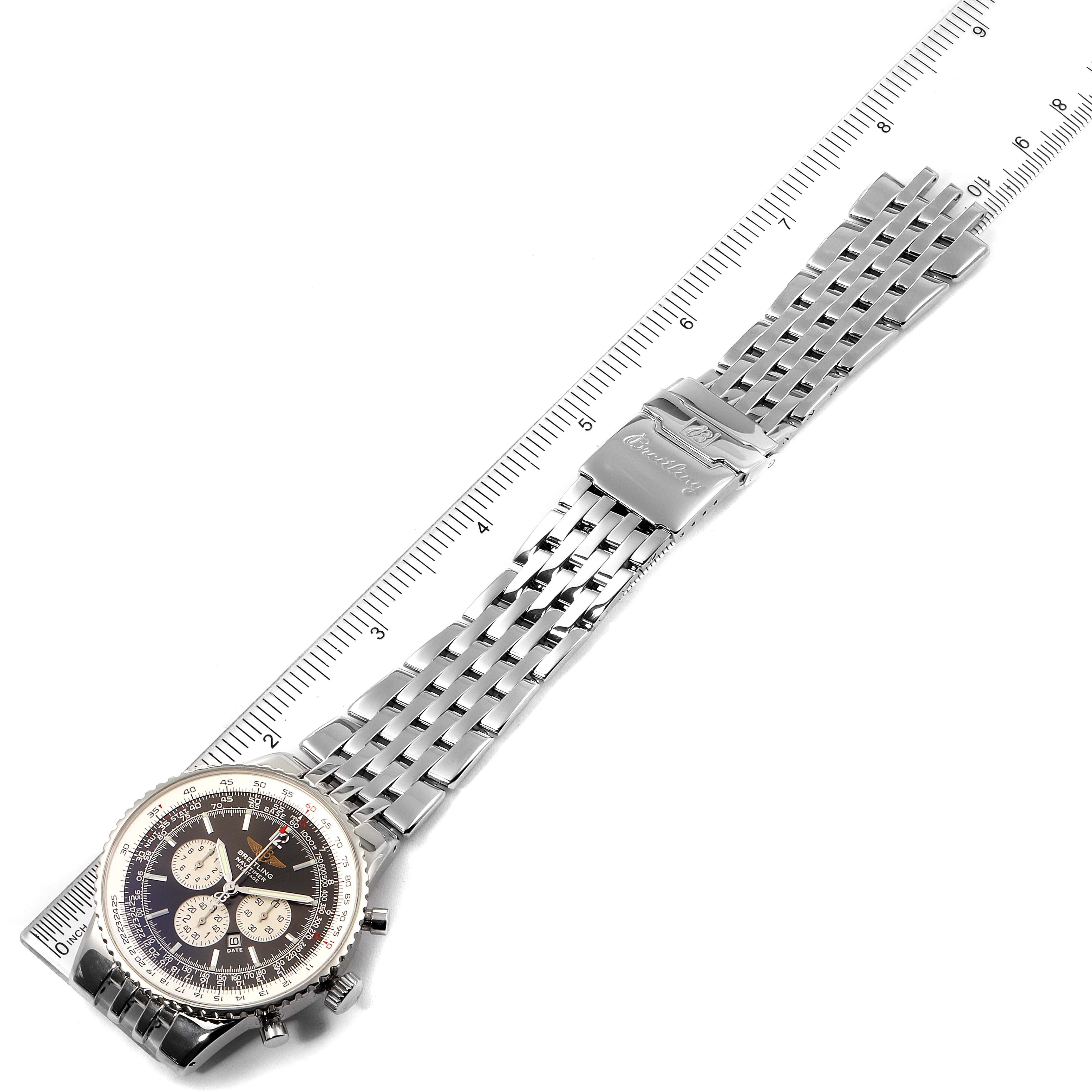 The image shows a top-down view of a Breitling Navitimer A35340 Men's Stainless Steel Grey Dial A35340 Men's Stainless Steel Grey Dial watch, displaying its face, stainless steel bracelet, and clasp alongside a ruler for scale.