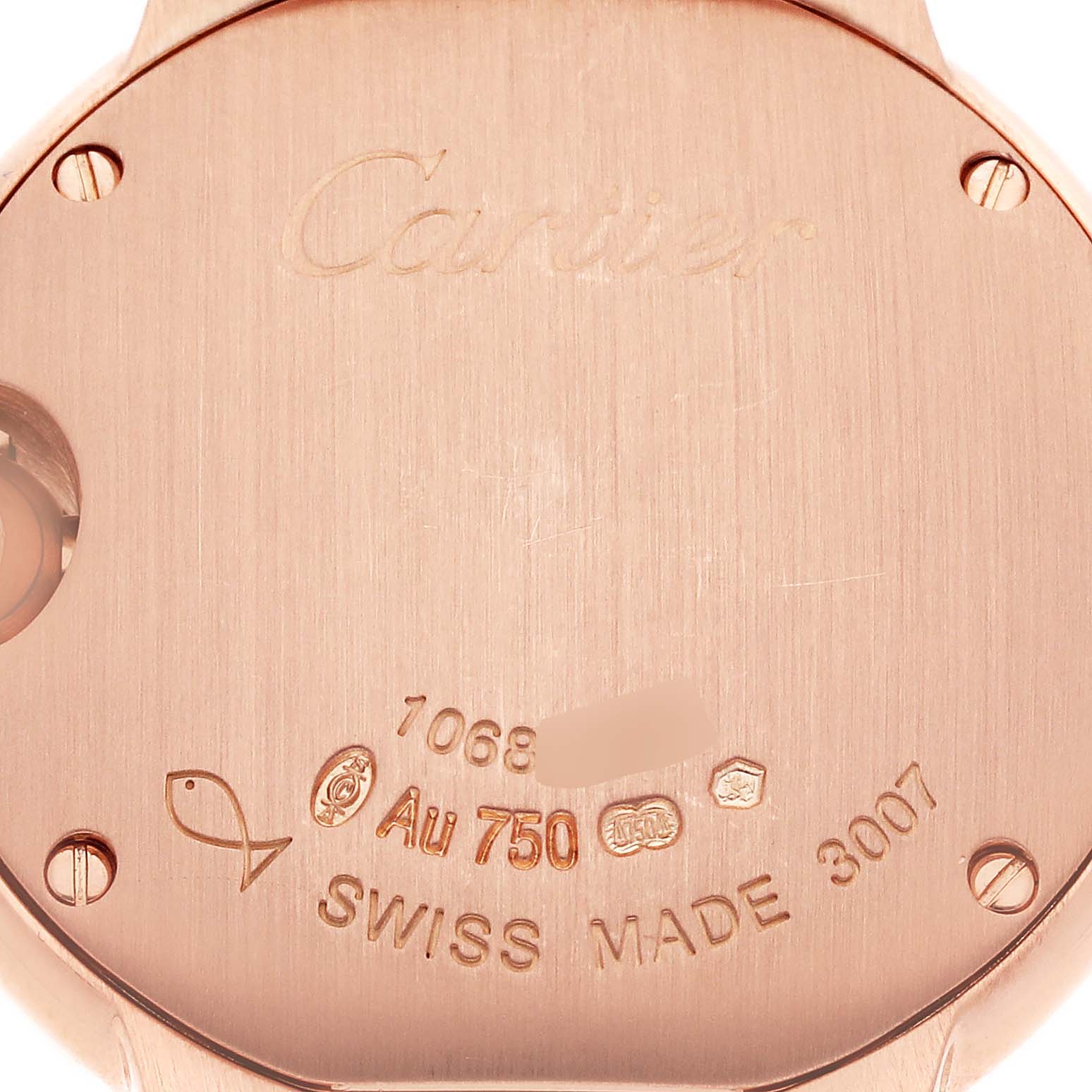 The angle shows the back case of the Cartier Ballon Bleu WE9002Z3 Women's Rose Gold Silver Dial WE9002Z3 Women's Rose Gold Silver Dial watch, featuring engravings and hallmarks.
