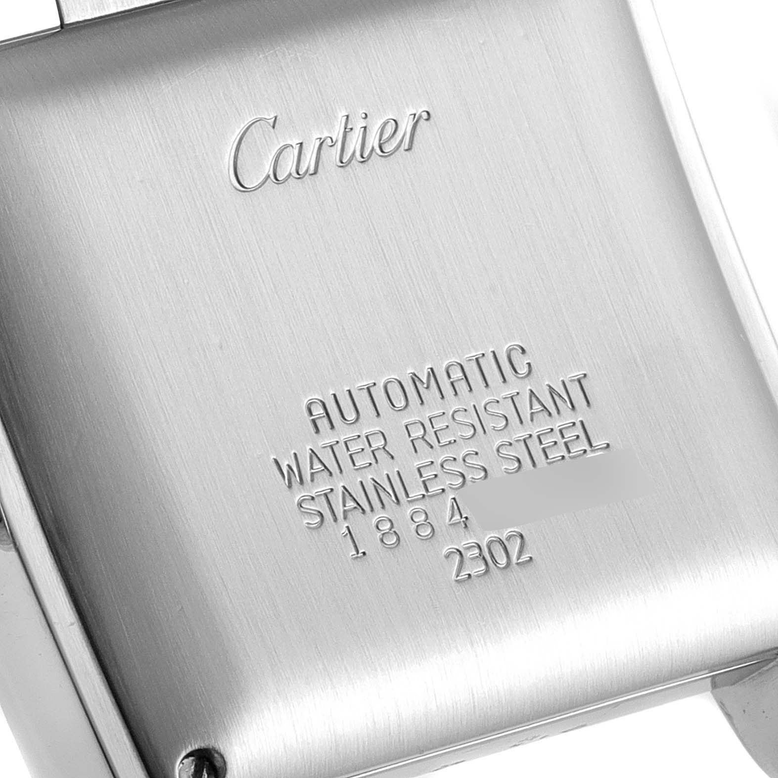 This image shows the engraved stainless steel case back of a Cartier Tank Francaise W51002Q3 Men's Stainless Steel Silver Dial W51002Q3 Men's Stainless Steel Silver Dial watch.