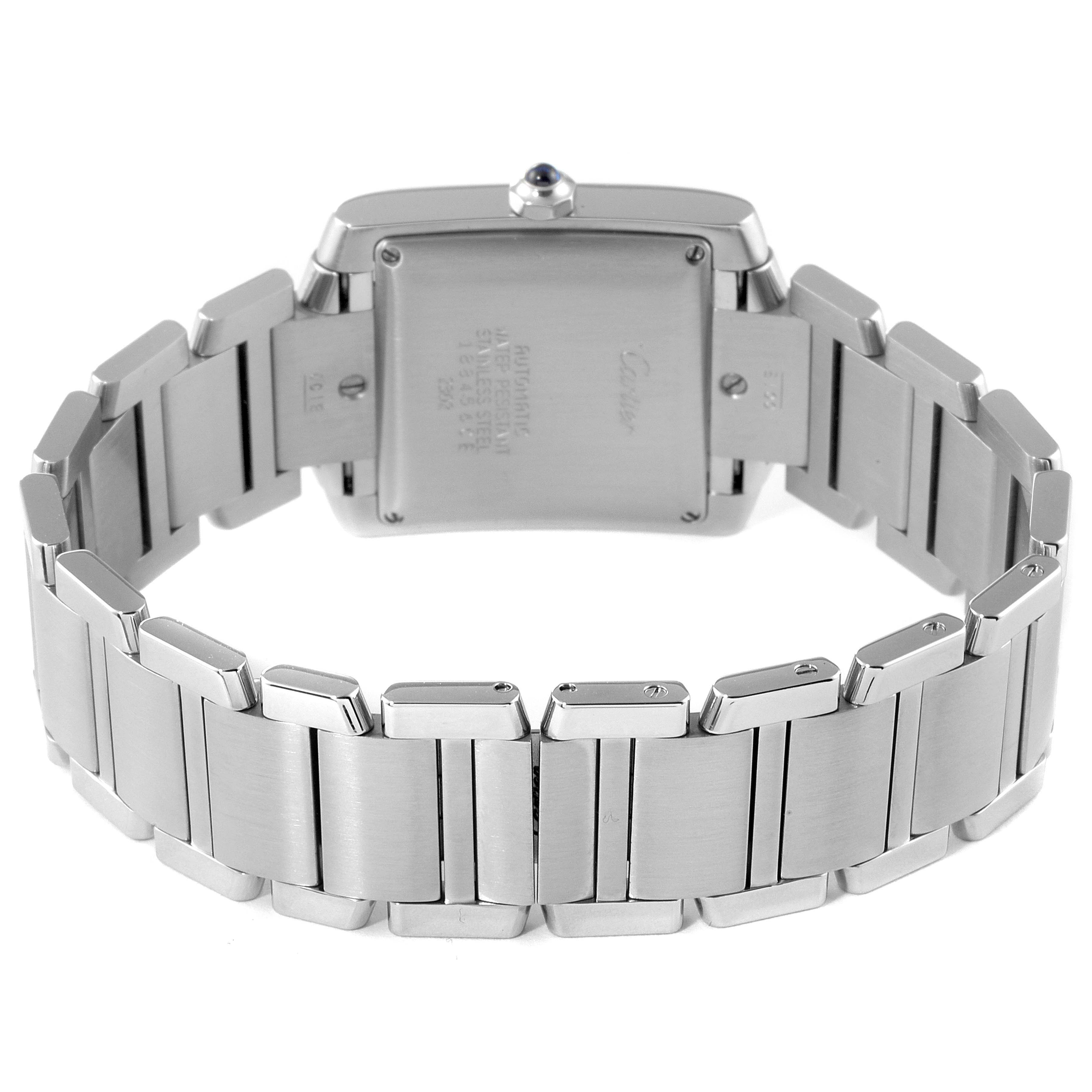 The image shows the back view of a Cartier Tank Francaise W51002Q3 Men's Stainless Steel Silver Dial W51002Q3 Men's Stainless Steel Silver Dial watch, highlighting its metal bracelet and case back.