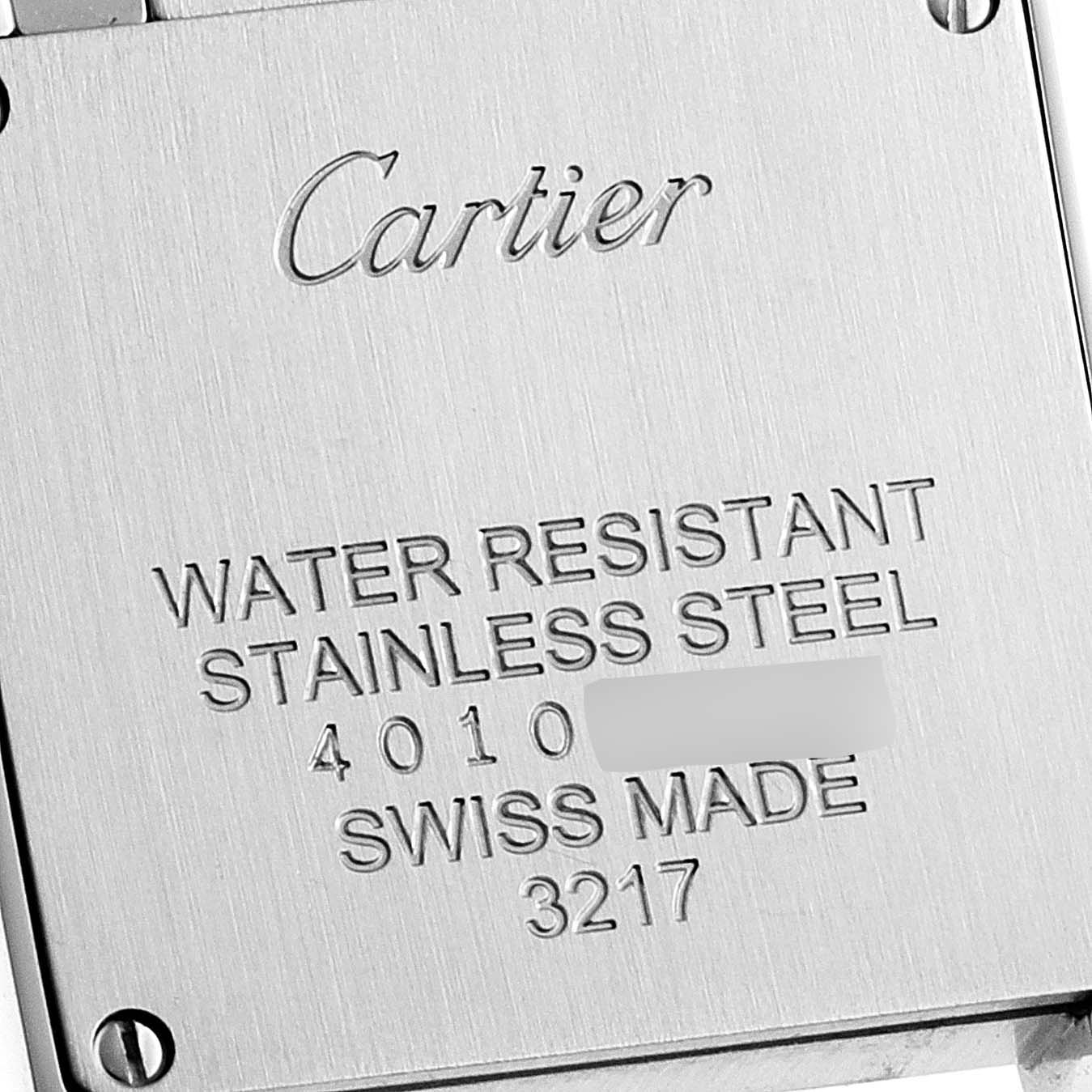 This image shows the back case of the Cartier Tank Française watch, displaying engraving details.