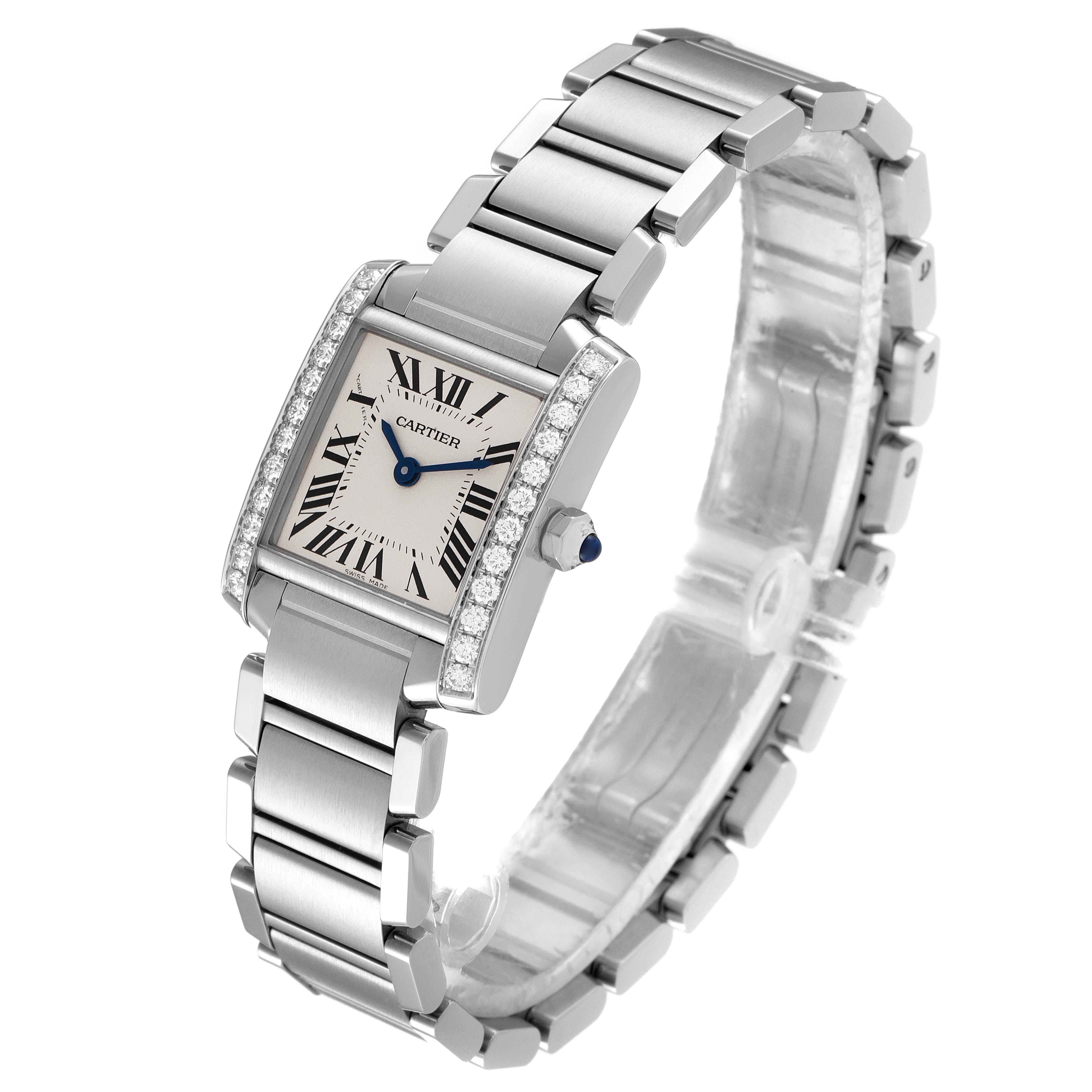 The image shows a Cartier Tank Francaise W4TA0008 Women's Stainless Steel Silver Dial W4TA0008 Women's Stainless Steel Silver Dial watch at a 45-degree angle, highlighting its face, bracelet, and diamond-studded bezel.