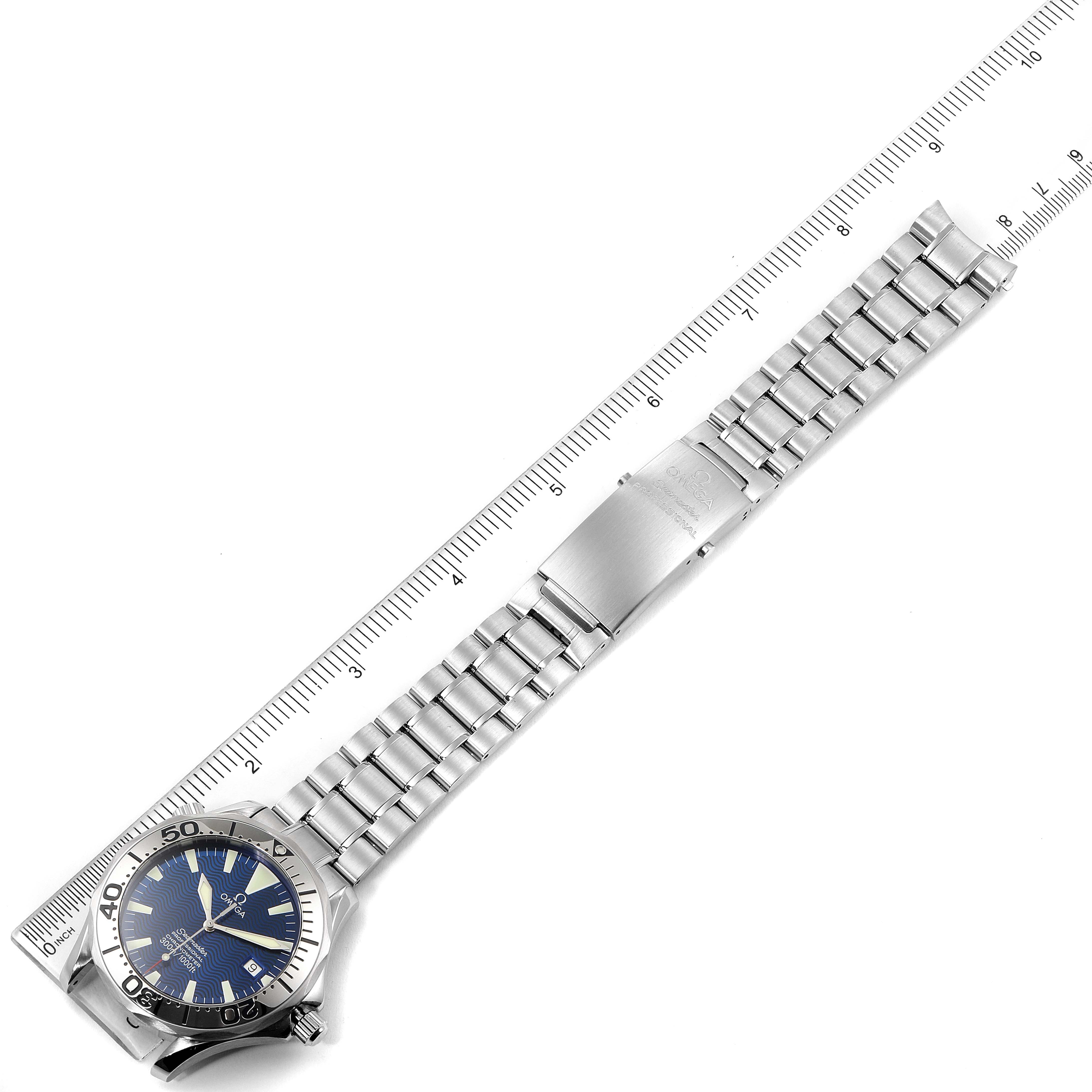 The Omega Seamaster 2255.80.00 Men's Stainless Steel Blue Dial 2255.80.00 Men's Stainless Steel Blue Dial watch is displayed horizontally, showing its face, bezel, strap, and clasp with a ruler for scale.