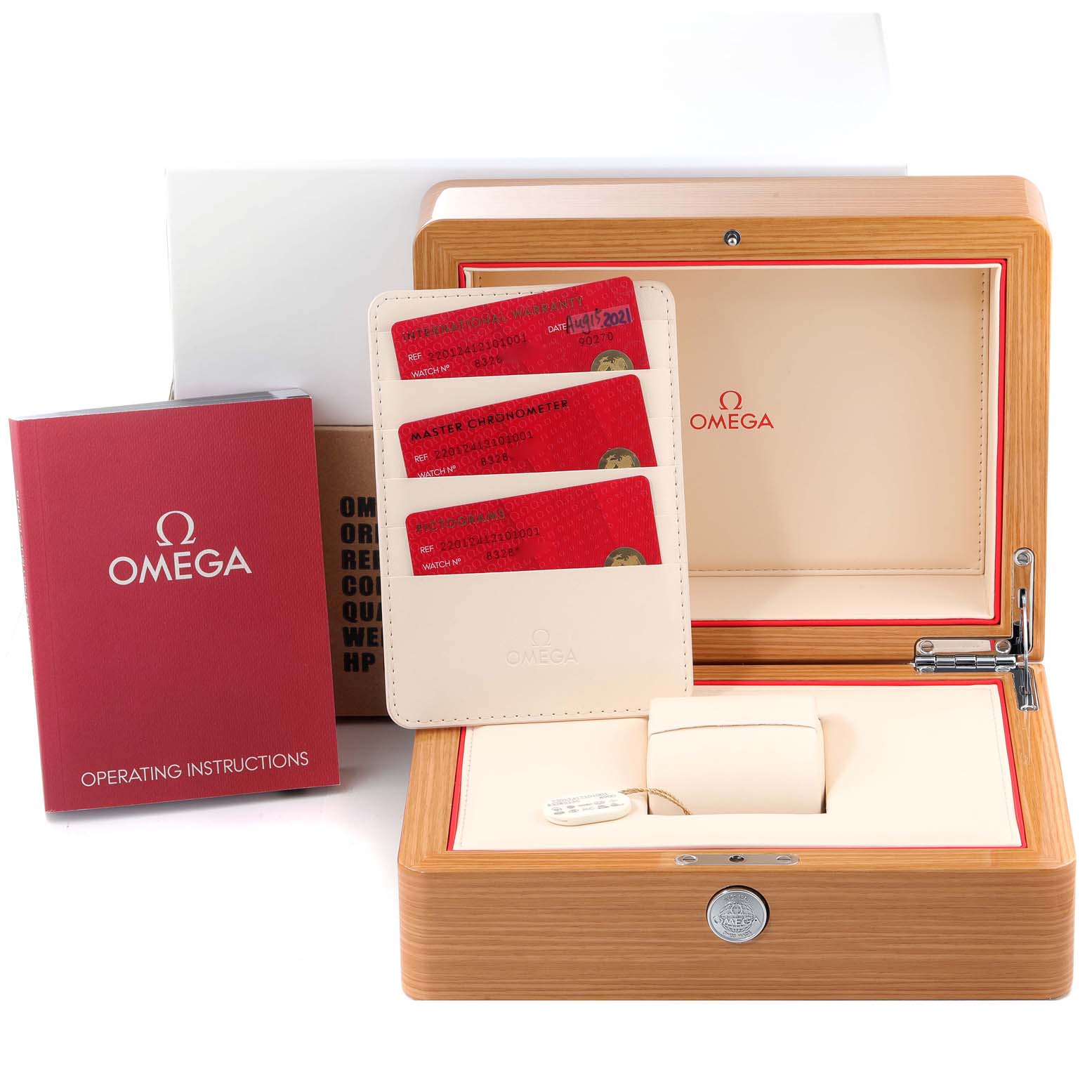 The image shows the packaging for an Omega Aqua Terra 220.12.41.21.01.001 Men's Stainless Steel Black Dial 220.12.41.21.01.001 Men's Stainless Steel Black Dial, including a wooden box, instruction book, and three red cards.