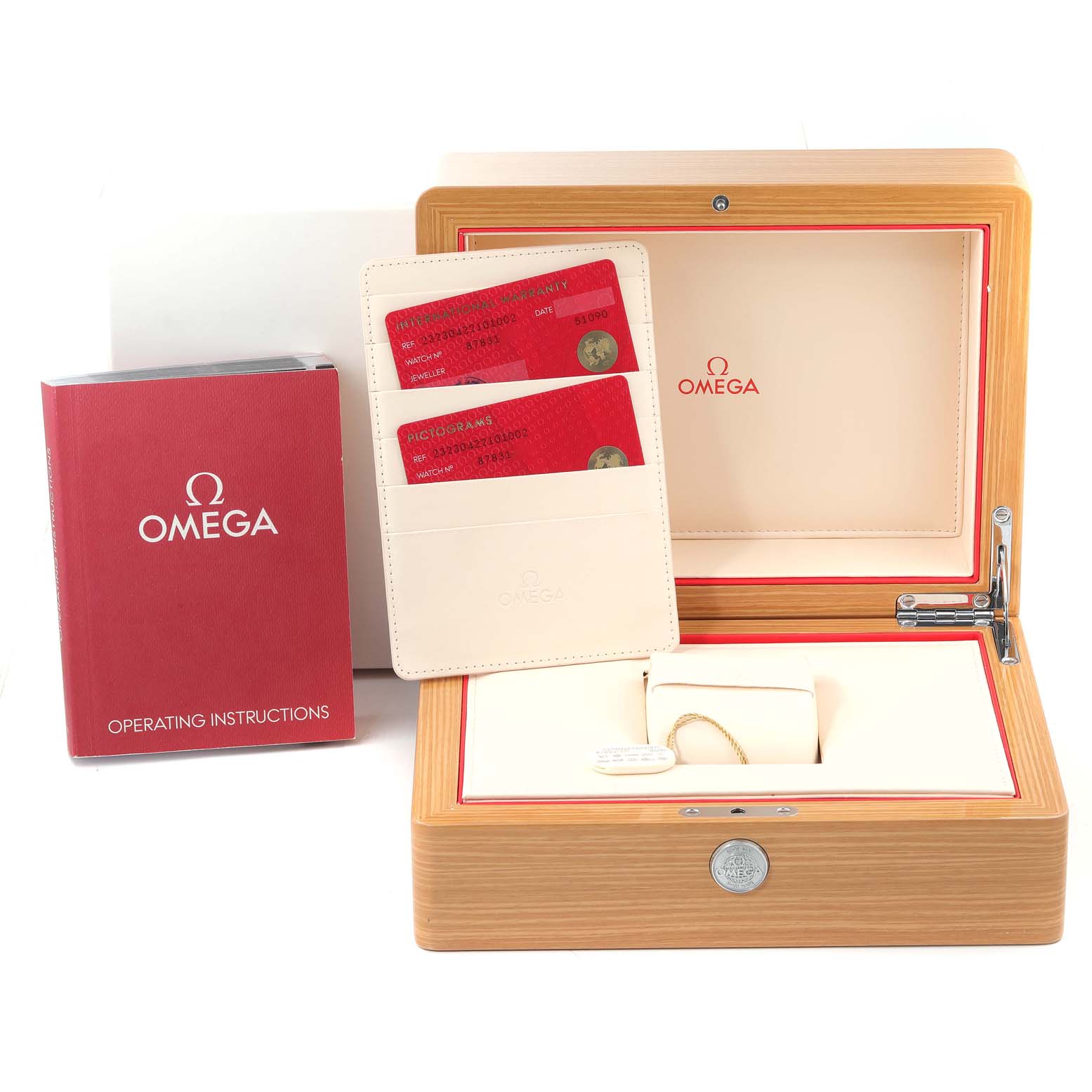 The image shows the Omega Planet Ocean 232.30.42.21.01.002 Men
s Stainless Steel Black Dial 232.30.42.21.01.002 Men
s Stainless Steel Black Dial watch box, operating instructions booklet, warranty cards, and a cardholder from a front angle.