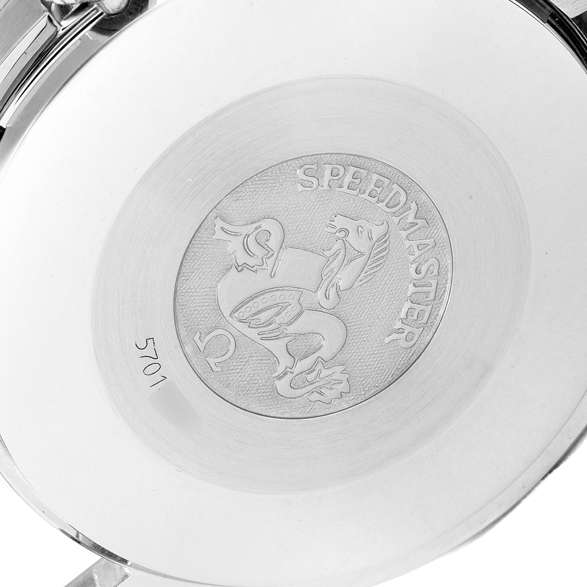 This image shows the back case of an Omega Speedmaster 3510.61.00 Men's Stainless Steel Red Dial 3510.61.00 Men's Stainless Steel Red Dial watch, featuring the engraved logo and model name.