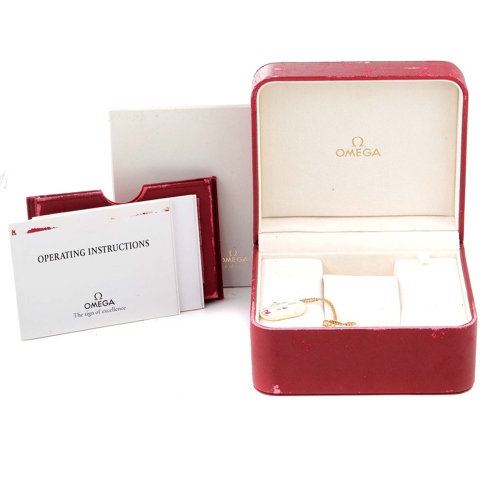 The image shows a red Omega Speedmaster 3510.61.00 Men's Stainless Steel Red Dial 3510.61.00 Men's Stainless Steel Red Dial watch box, operating instructions, and additional packaging.