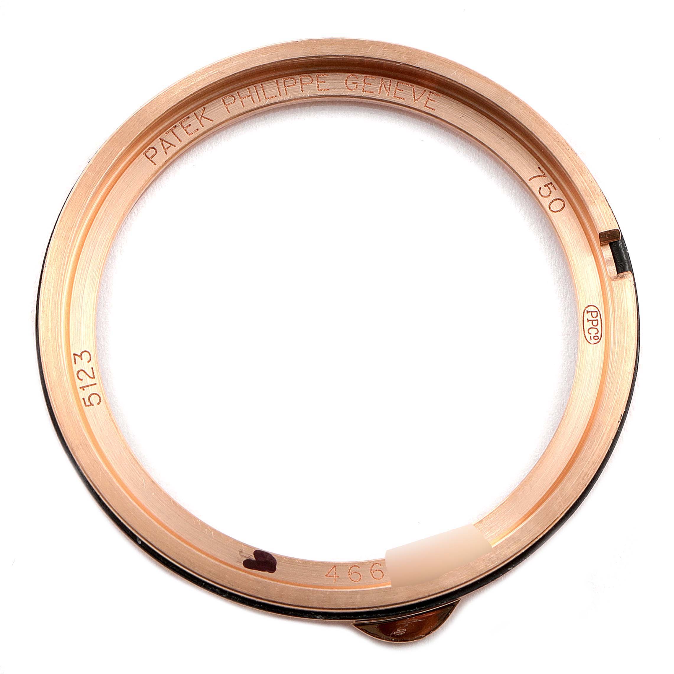 This image shows the rose gold bezel of a Patek Philippe Calatrava 5123R-001 Men's Rose Gold Silver Dial 5123R-001 Men's Rose Gold Silver Dial model, viewed from above.