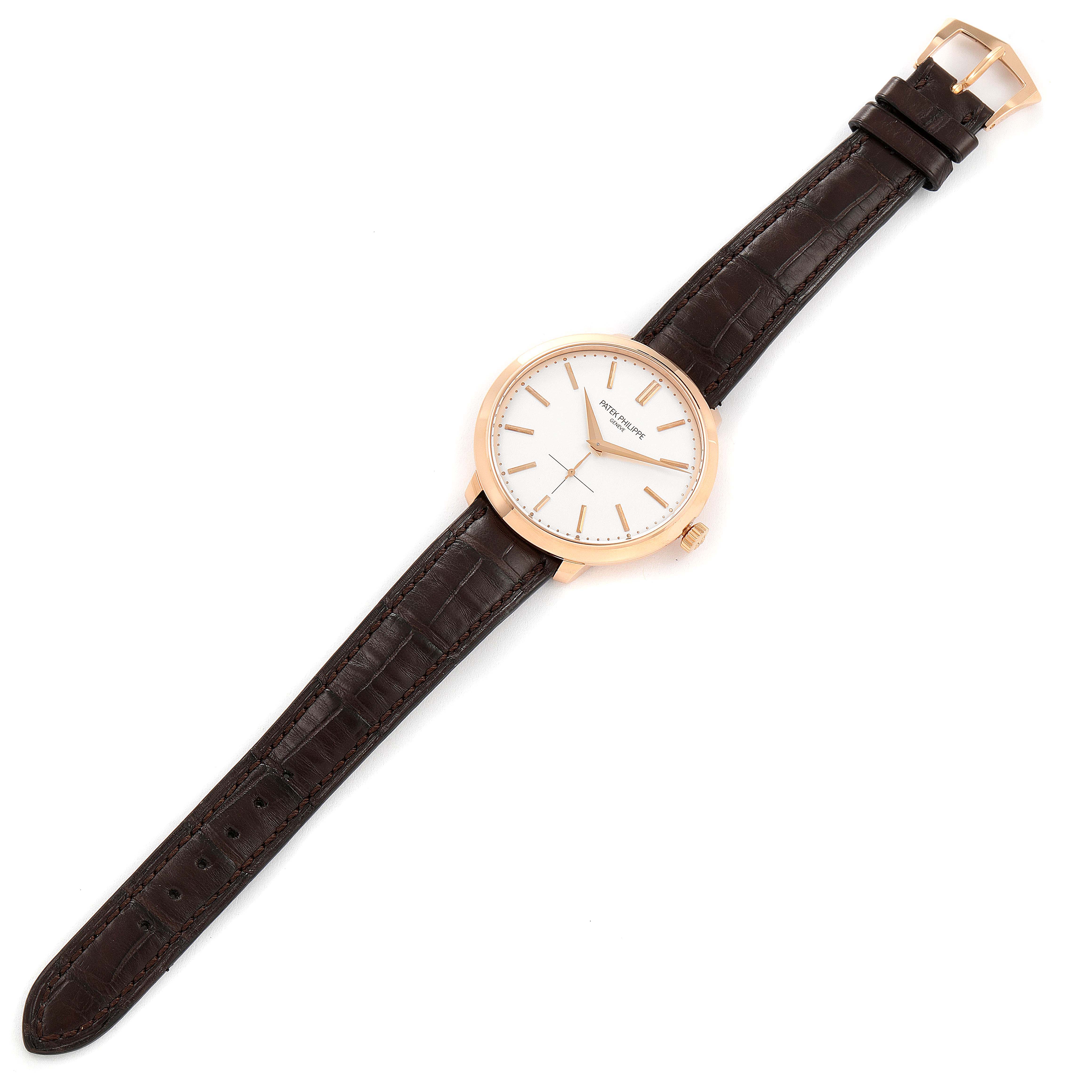 The image shows a top-down view of a Patek Philippe Calatrava 5123R-001 Men's Rose Gold Silver Dial 5123R-001 Men's Rose Gold Silver Dial watch with a white dial and a brown leather strap.