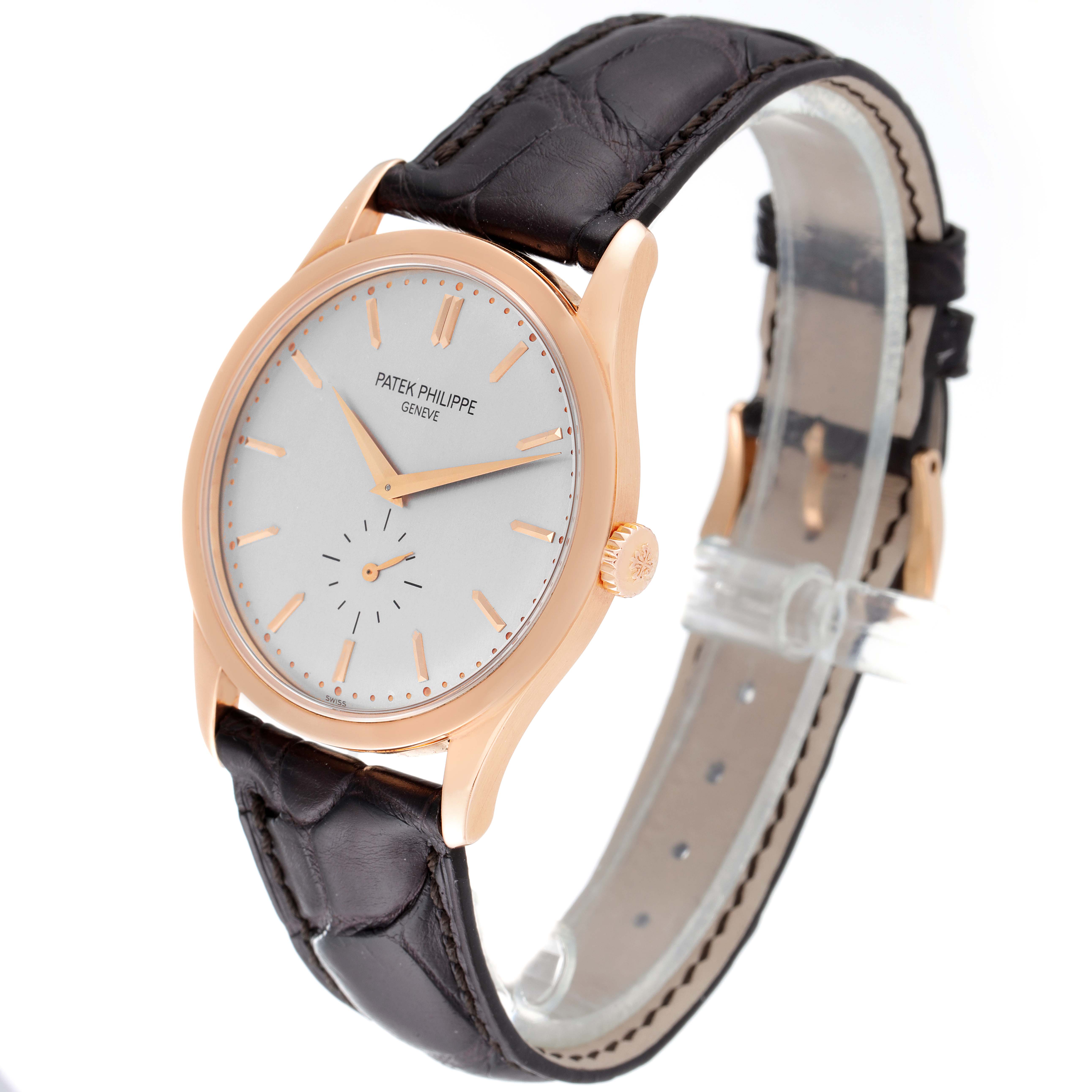 The Patek Philippe Calatrava 5196R Men's Rose Gold Silver Dial 5196R Men's Rose Gold Silver Dial watch is shown at an angled view, highlighting the dial, case, crown, and leather strap.