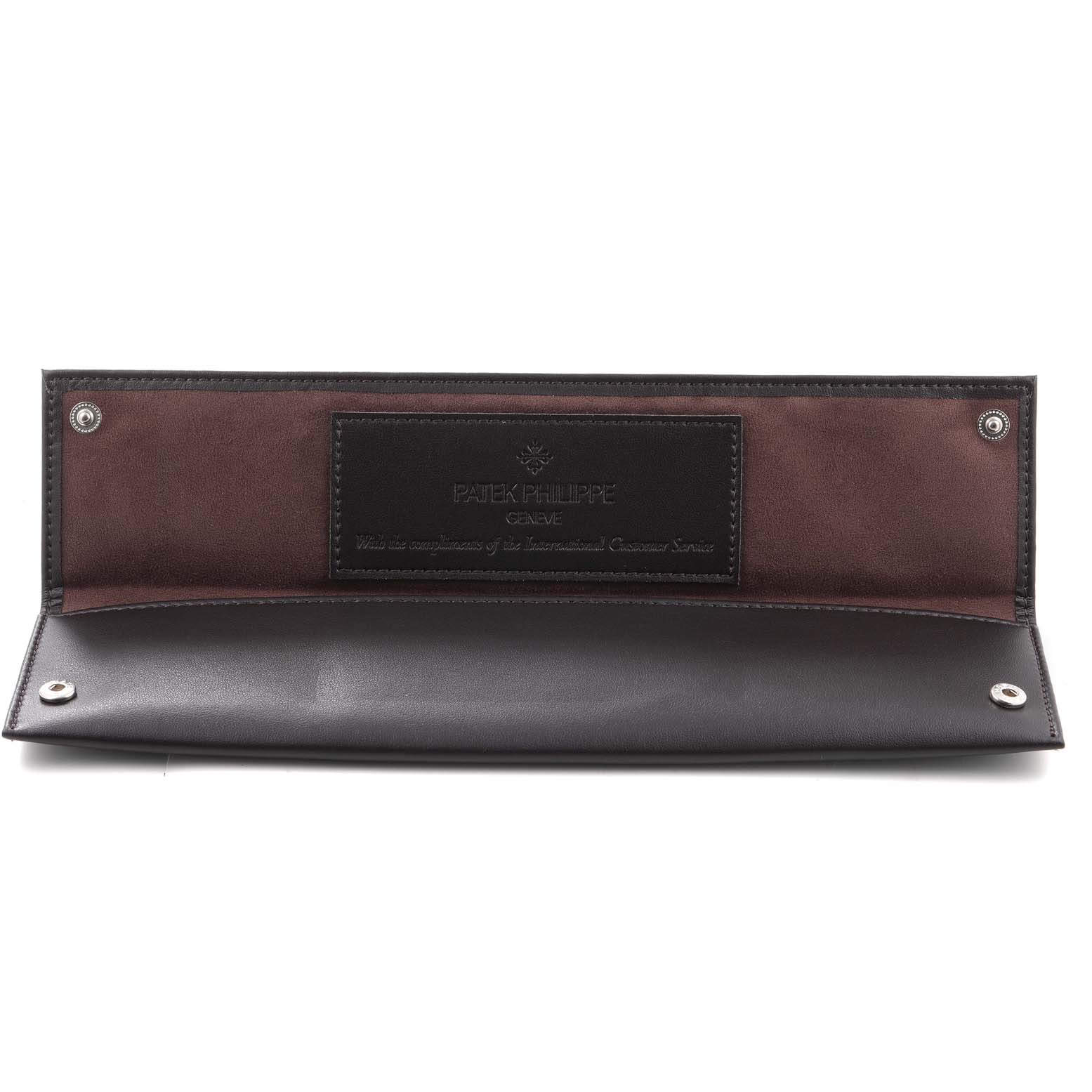This is a leather pouch designed for a Patek Philippe Calatrava 5196R Men's Rose Gold Silver Dial 5196R Men's Rose Gold Silver Dial watch, shown opened with the logo and snap closures visible.