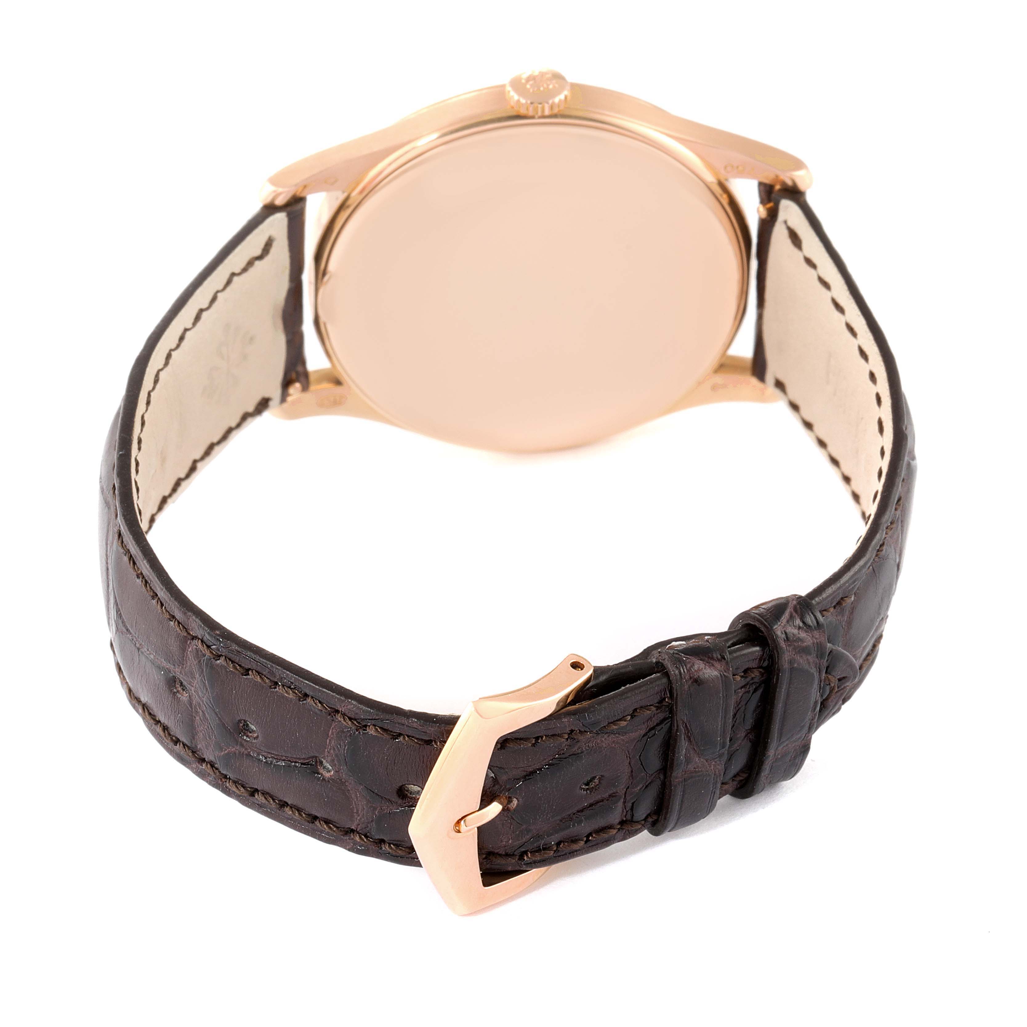 This image shows the back view of the Patek Philippe Calatrava 5196R Men's Rose Gold Silver Dial 5196R Men's Rose Gold Silver Dial watch, highlighting the case, crown, and leather strap with the buckle.