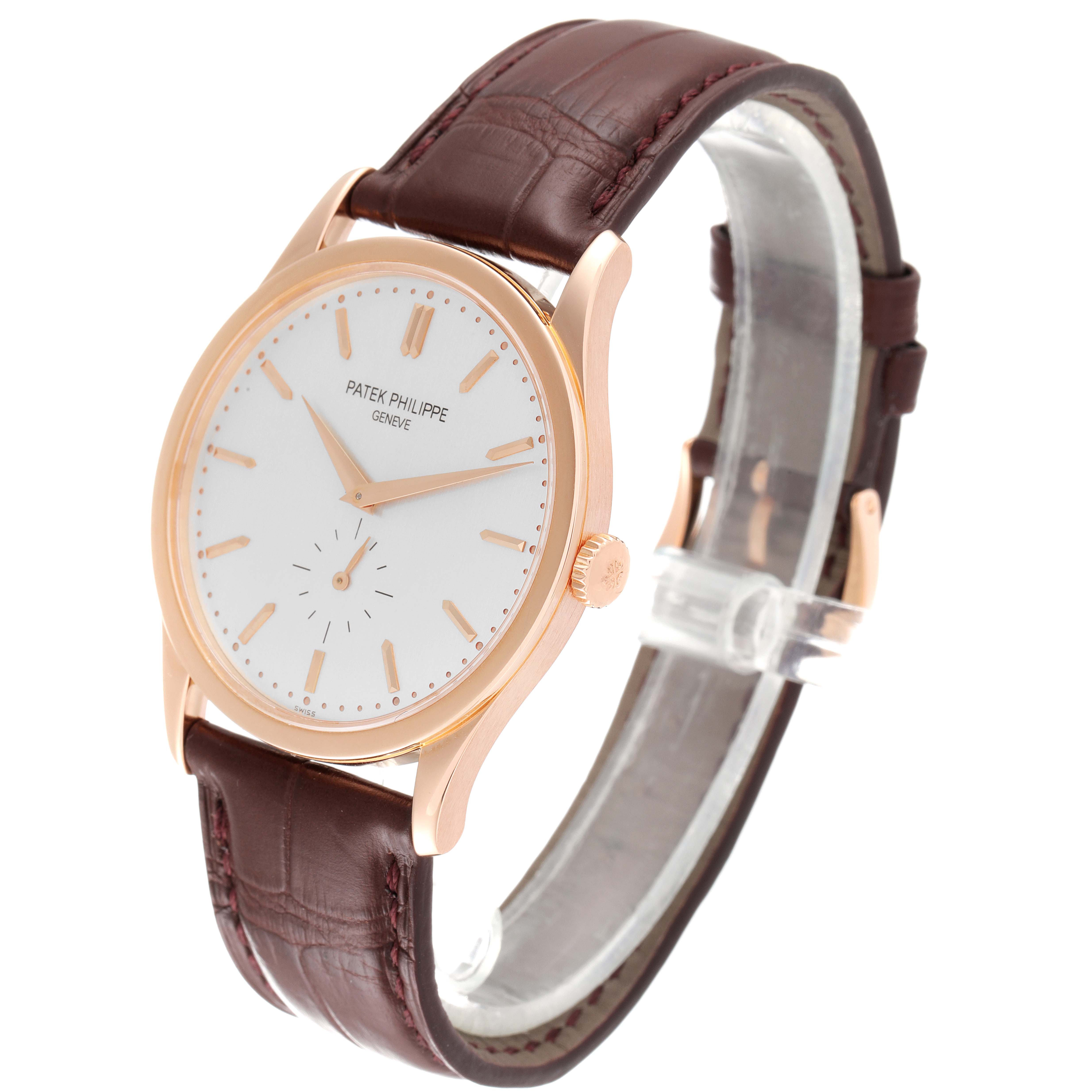 This image shows a side angle view of the Patek Philippe Calatrava 5196R Men's Rose Gold Silver Dial 5196R Men's Rose Gold Silver Dial watch, highlighting the dial, crown, and leather strap.