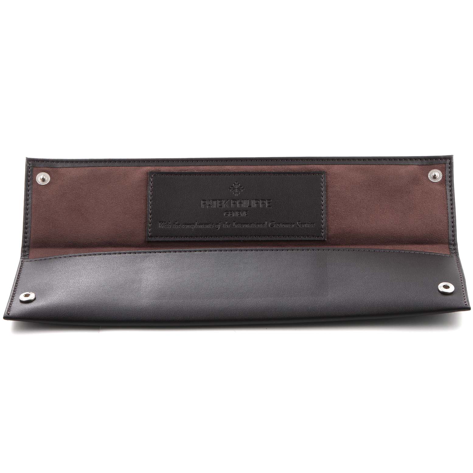 This is an open leather case for the Calatrava model by Patek Philippe, showing the interior with snap buttons.