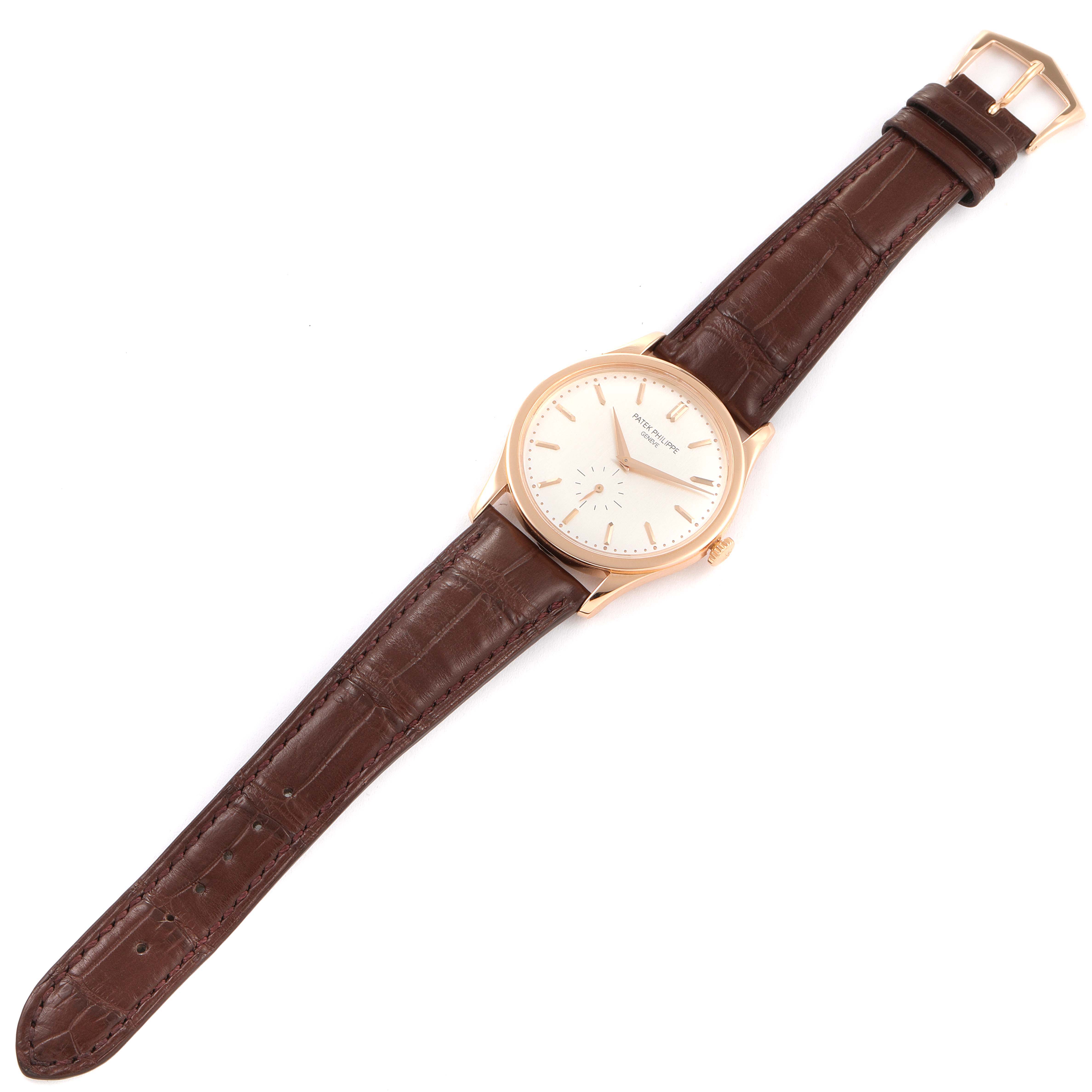 This image shows a Patek Philippe Calatrava 5196R Men's Rose Gold Silver Dial 5196R Men's Rose Gold Silver Dial watch laid flat, displaying the watch face and full leather strap.